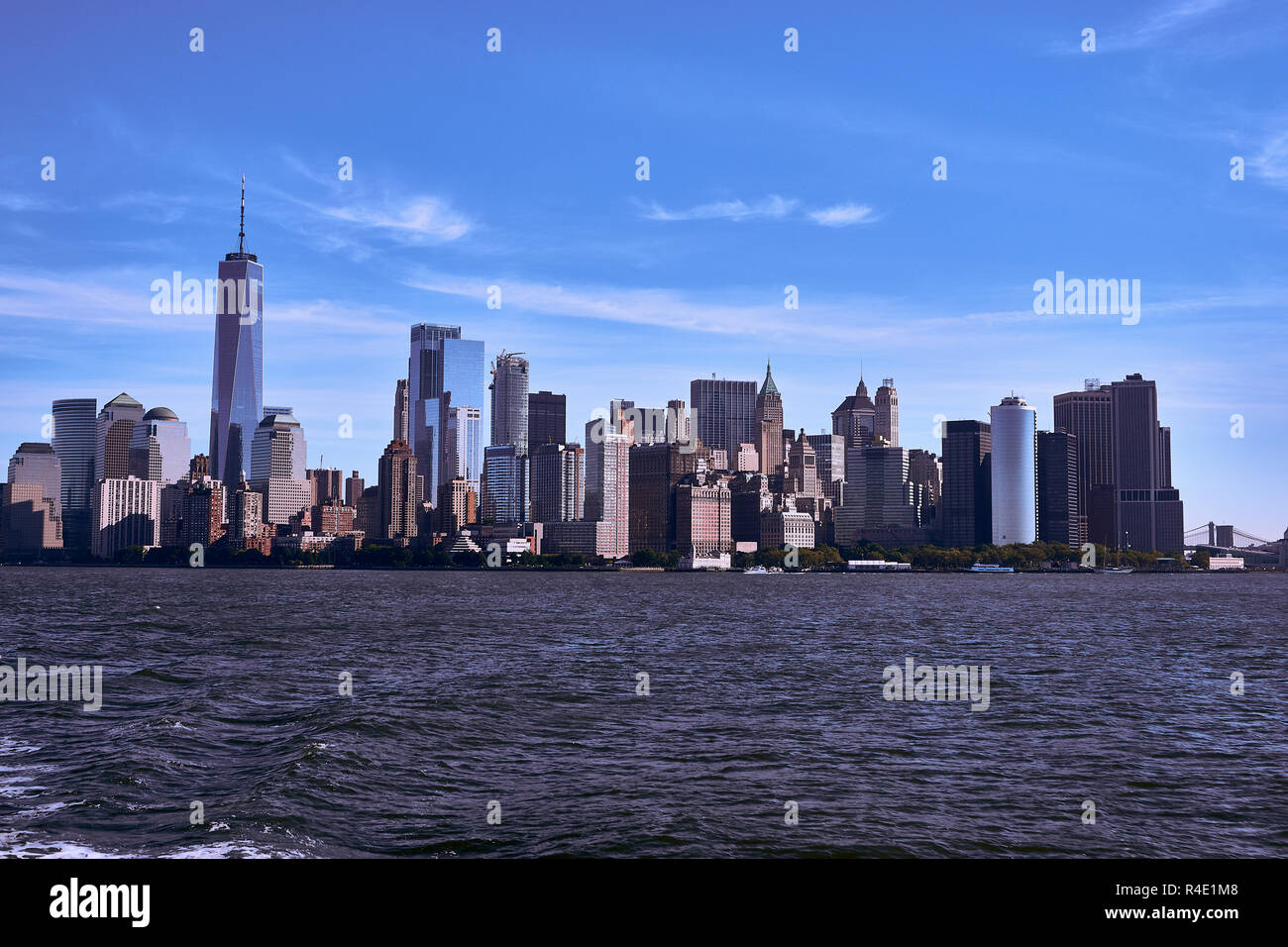 New York City skyline, a blue sky and water Stock Photo - Alamy