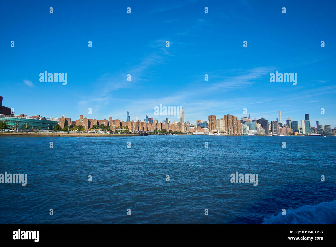 New York City high buildings, a blue sky and water Stock Photo