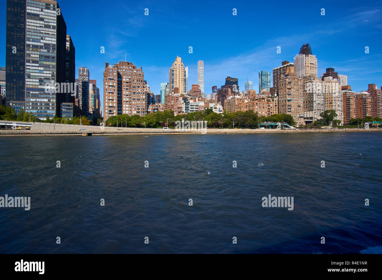 New York City high buildings, a blue sky and water Stock Photo