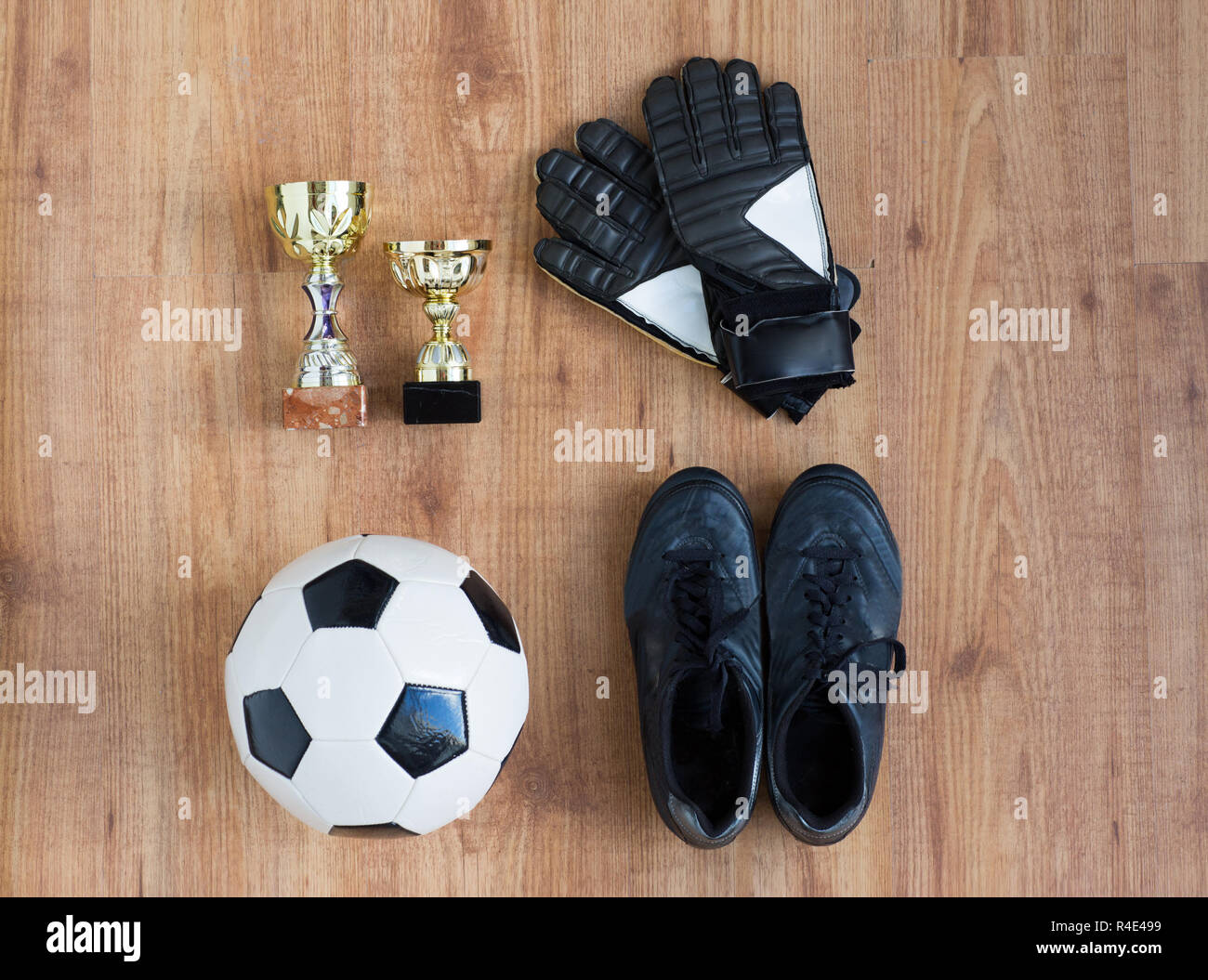 soccer ball, boots, goalkeeper gloves and cups Stock Photo Alamy