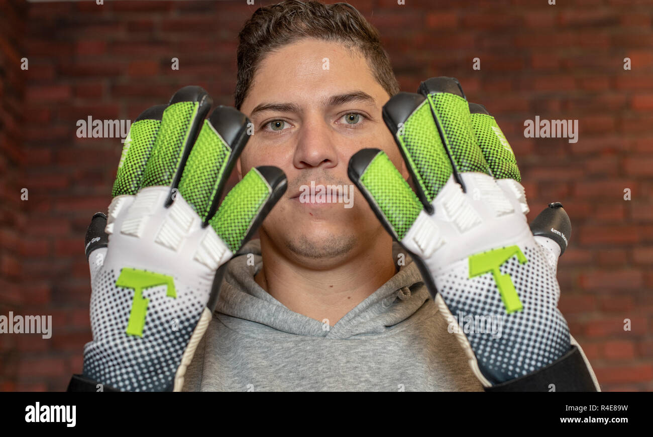 Herbolzheim, Germany. 23rd Nov, 2018. Matthias Leibitz, Managing Director  of T1TAN GmbH, is standing in the business premises wearing goalkeeper  gloves manufactured by his company. On 27.11.2018 a trial begins in Munich