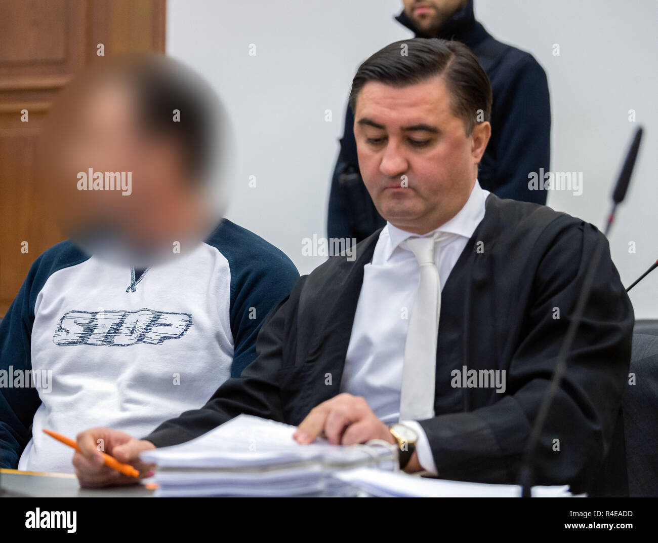 27 November 2018, Hessen, Gießen: The 48-year-old defendant (l) sits before the trial in the courtroom of the Regional Court next to his defender Alois Kovac. About three years ago, the son of the billionaire Würth was kidnapped. Together with accomplices, the accused is said to have kidnapped the handicapped son of the Baden-Württemberg entrepreneur Reinhold Würth in June 2015 in Schlitz, East Hesse, and demanded a ransom of three million euros. After a failed handover the victim was found one day later in a forest near Würzburg, unharmed and chained to a tree. Photo: Silas Stein/dpa - ATTENT Stock Photo