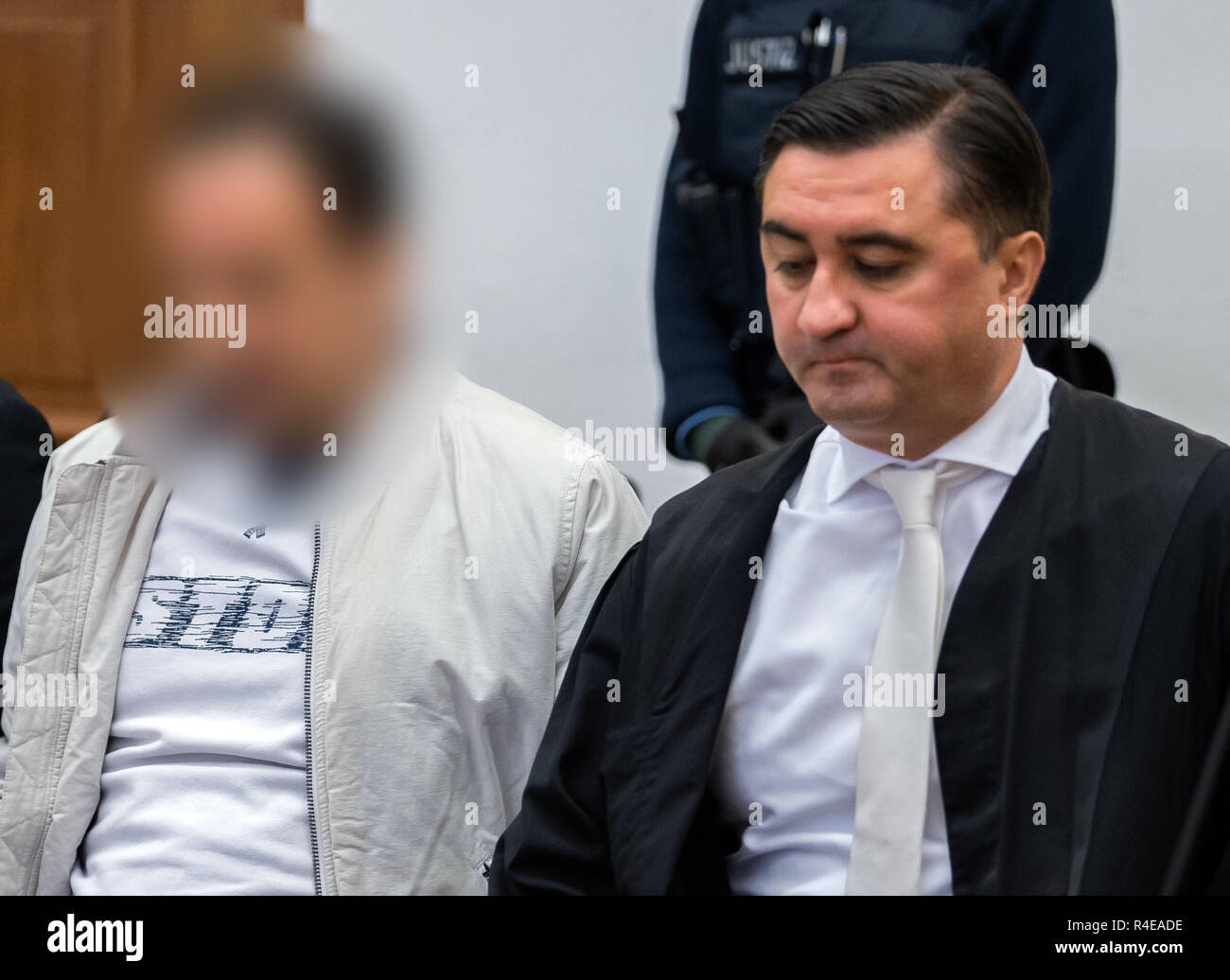 27 November 2018, Hessen, Gießen: The 48-year-old defendant (l) sits before the trial in the courtroom of the Regional Court next to his defender Alois Kovac. About three years ago, the son of the billionaire Würth was kidnapped. Together with accomplices, the accused is said to have kidnapped the handicapped son of the Baden-Württemberg entrepreneur Reinhold Würth in June 2015 in Schlitz, East Hesse, and demanded a ransom of three million euros. After a failed handover the victim was found one day later in a forest near Würzburg, unharmed and chained to a tree. Photo: Silas Stein/dpa - ATTENT Stock Photo