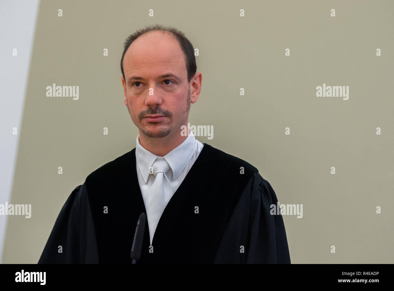 27 November 2018, Hessen, Gießen: Jost Holtzmann, judge at the Regional Court of Gießen, is about to begin his trial in the courtroom of the Regional Court. About three years ago, the son of the billionaire Würth was kidnapped. Together with accomplices, the accused is said to have kidnapped the handicapped son of the Baden-Württemberg entrepreneur Reinhold Würth in June 2015 in Schlitz, East Hesse, and demanded a ransom of three million euros. After a failed handover the victim was found one day later in a forest near Würzburg, unharmed and chained to a tree. Photo: Silas Stein/dpa Stock Photo