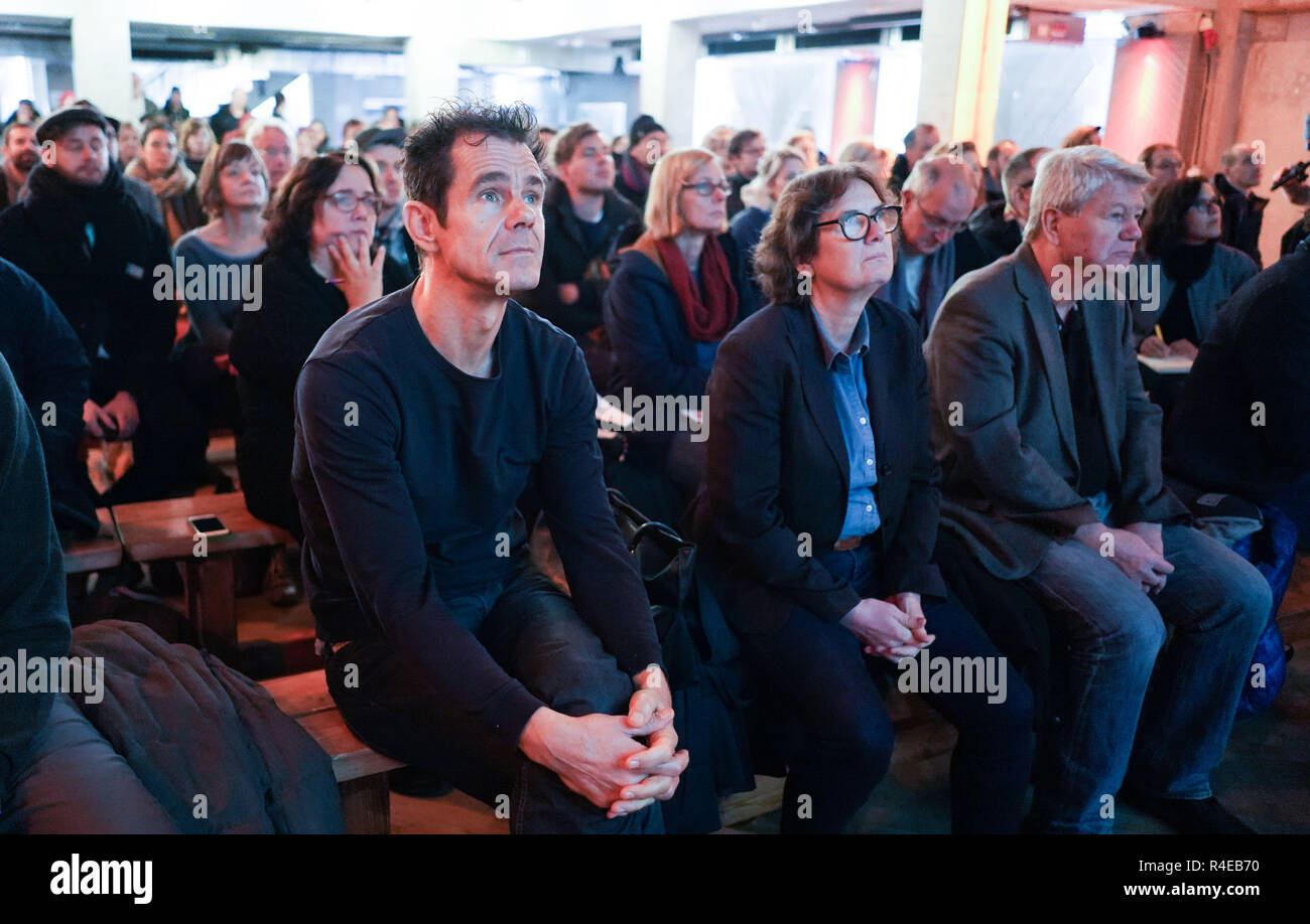 Berlin, Germany. 27th Nov, 2018. Tom Tykwer (l-r), film director, Barbara Hoidn, architect, and Wolfgang Wieland (Bündnis90/Die Grünen), former Berlin Senator of Justice, take part in a press conference of the Holzmarkt-Genossenschaft on the dispute with the State of Berlin about the building project on Holzmarktstraße. Credit: Jörg Carstensen/dpa/Alamy Live News Stock Photo
