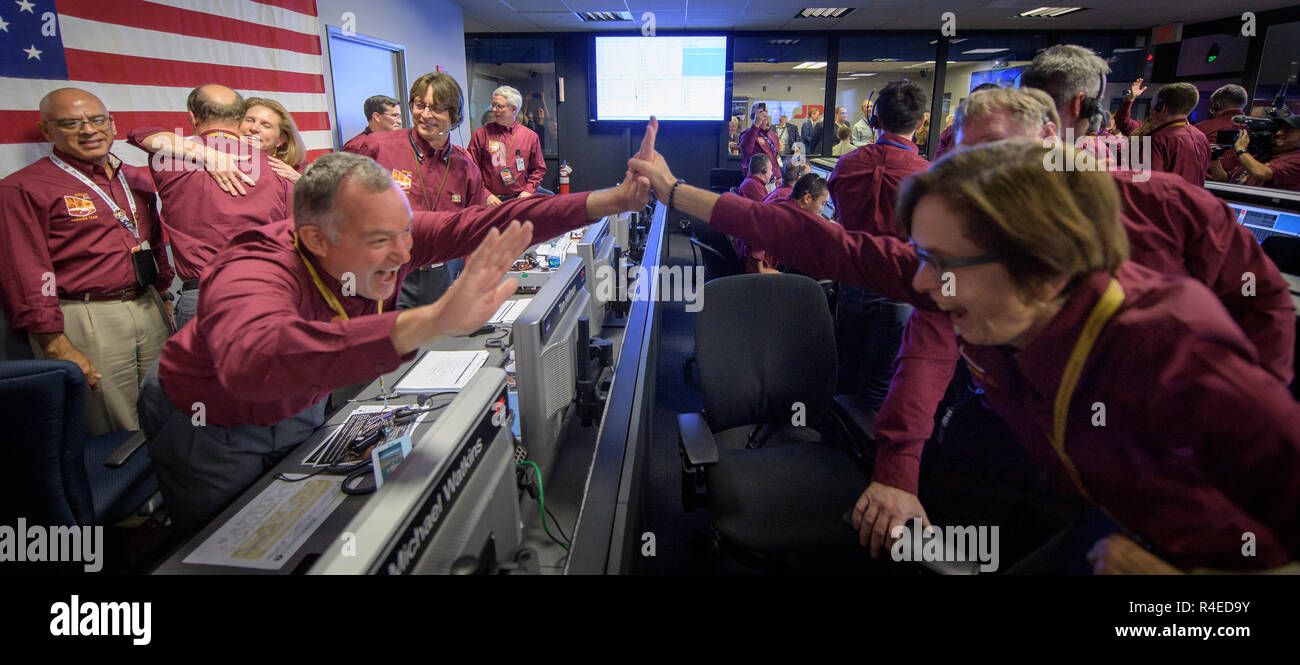 Tom Hoffman, InSight Project Manager, left, and Sue Smrekar, InSight deputy principal investigator, react after receiving confirmation that the Mars InSight lander successfully touched down on the surface of Mars November 26, 2018 inside the Mission Support Area of the Jet Propulsion Laboratory in Pasadena, California. InSight, short for Interior Exploration using Seismic Investigations, Geodesy and Heat Transport, is a Mars lander designed to study the inner space of Mars. Stock Photo