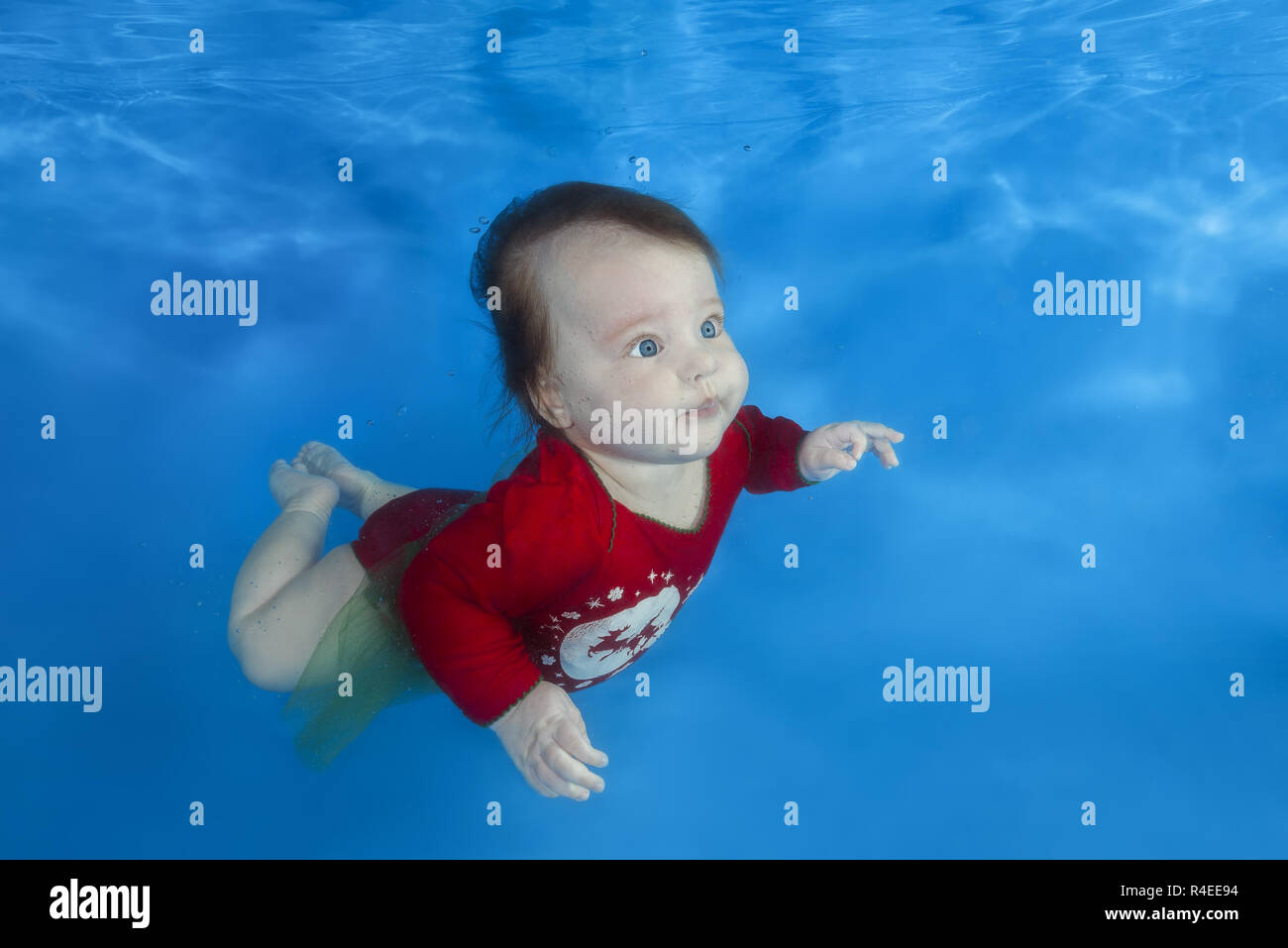 Odessa, Ukraine, Europe. 14th Nov, 2018. Little girl in red suit learns