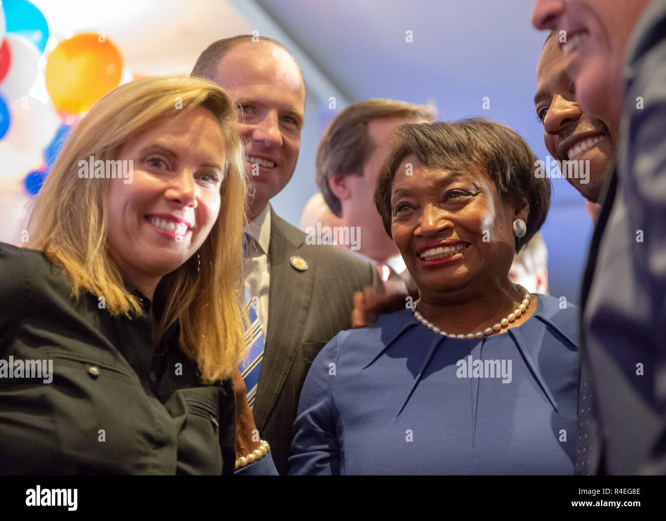 November 6, 2018 - Garden City, New York, United States - At center, ANDREA STEWART-COUSINS, who represents District 35 in the New York State Senate and serves as Senate Democratic Leader, and, at left, Hempstead Town Supervisor LAURA GILLEN, are on stage with other candidates and elected officials. Nassau County Democrats watched Election Day results at Garden City Hotel, Long Island. (Credit Image: © Ann Parry/ZUMA Wire) Stock Photo