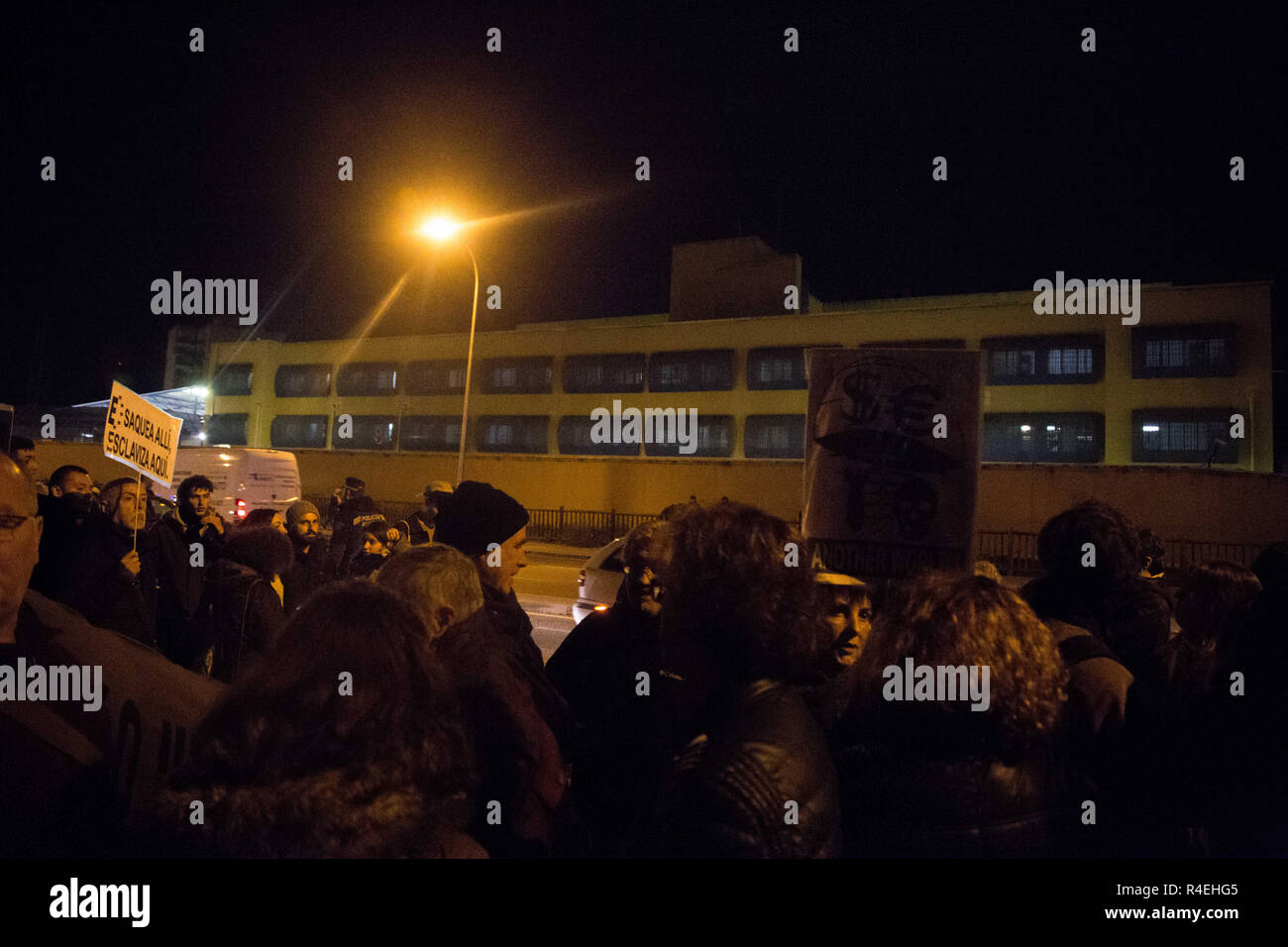 Madrid, Spain. 27th Nov, 2018. Hundreds of protesters are seen gathered in front of the Aluche Immigrant Detention Centre during the protest.Demonstration was held in front of the Immigration Detention Centre to demand for the closure of this centre and the rest in Europe for treating undocumented immigrants as criminals, depriving them of freedom, against Human Rights and for the racist treatment in them. Credit: Lito Lizana/SOPA Images/ZUMA Wire/Alamy Live News Stock Photo