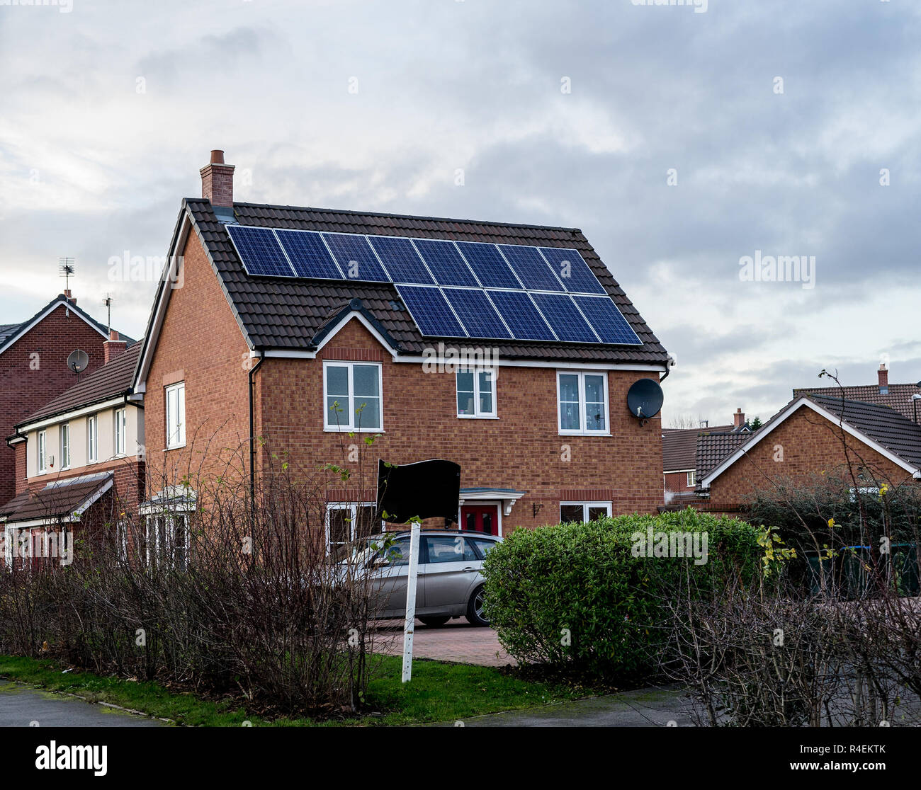 English House with Solar Panels on roof for electricity Stock Photo