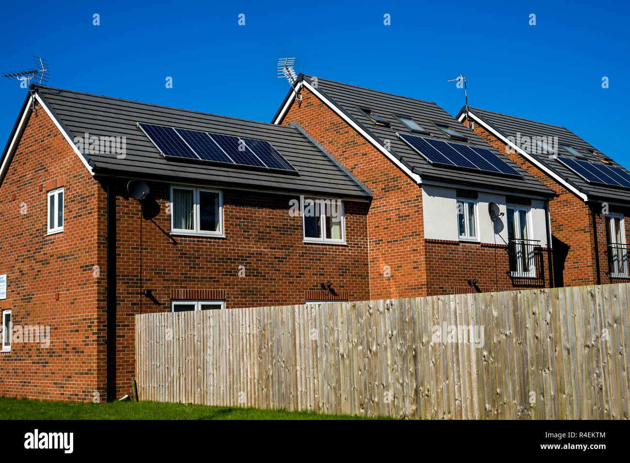 Solar energy smart home system with electric solar panels on roof in UK Stock Photo