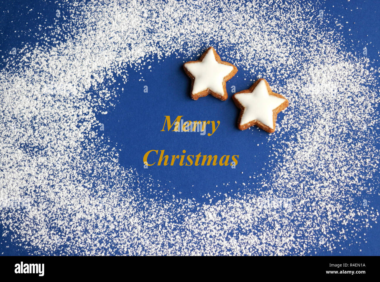 blue and white christmas background with stars, powdered sugar as snow ...