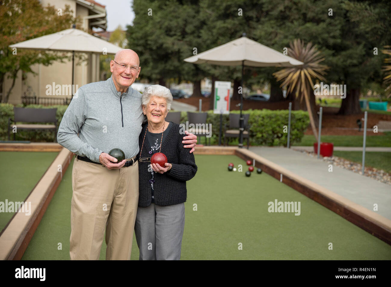 Senior Couple Holding Bowling Balls Stock Photo
