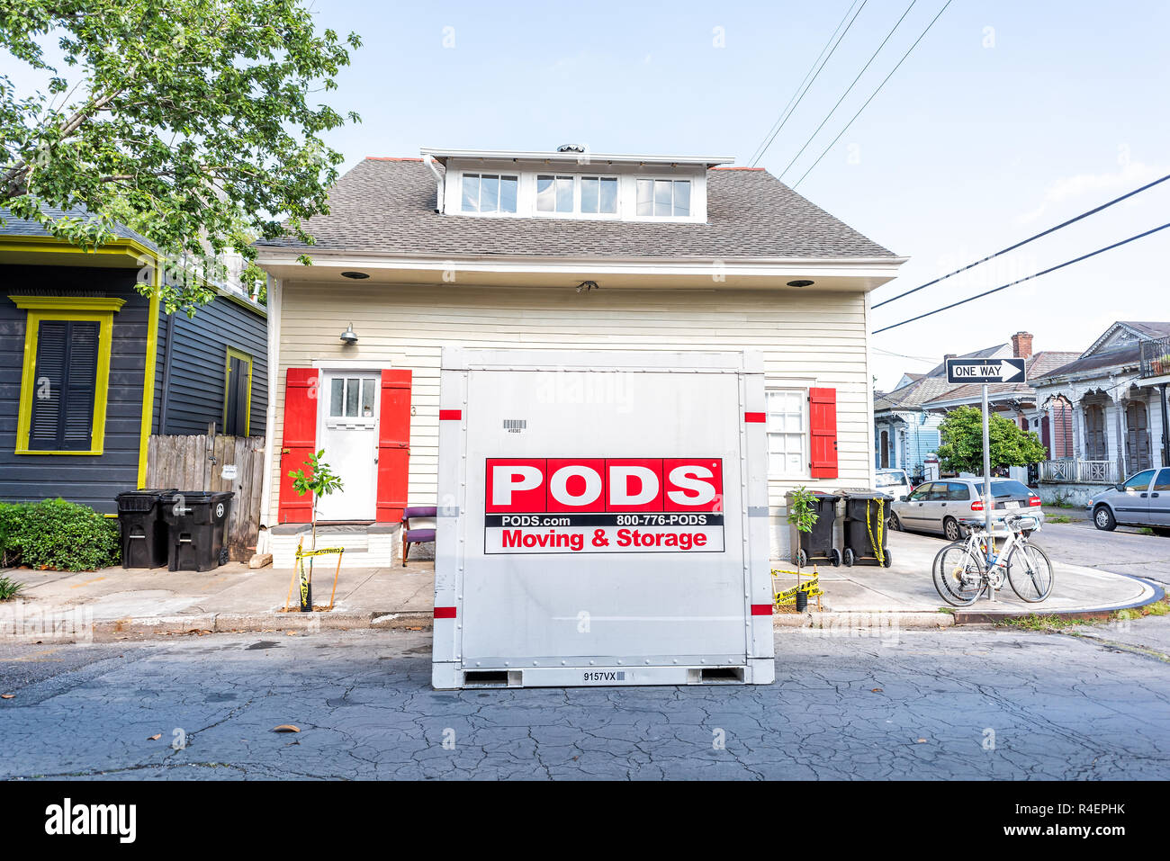 New Orleans, USA - April 23, 2018: Street historic Marigny neighborhood district in Louisiana town, city sidewalk, Pods storage container for moving o Stock Photo