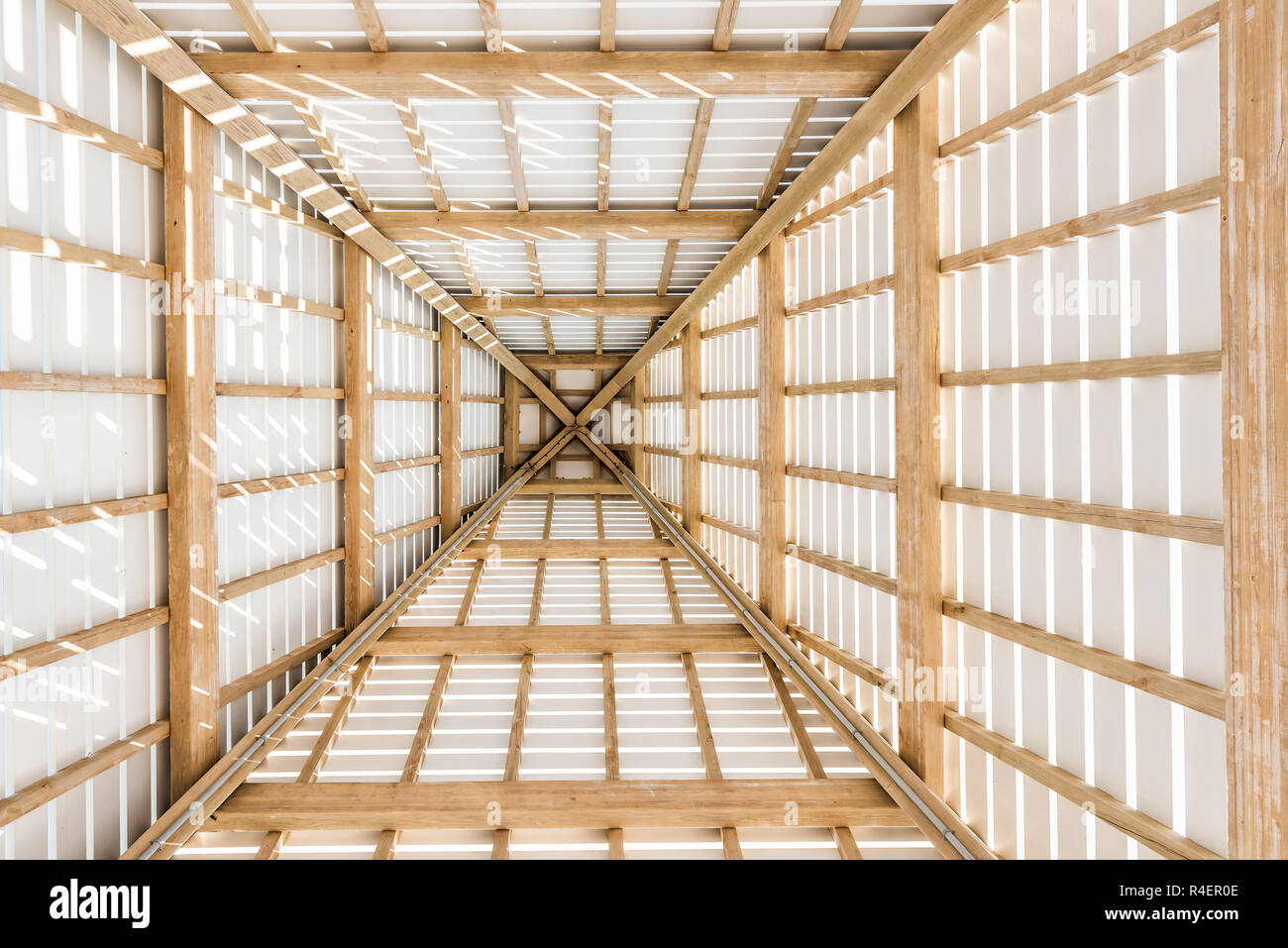 Looking up abstract low angle of wooden pavilion tower roof ceiling closeup by beach ocean gazebo in Florida, architecture, view Stock Photo