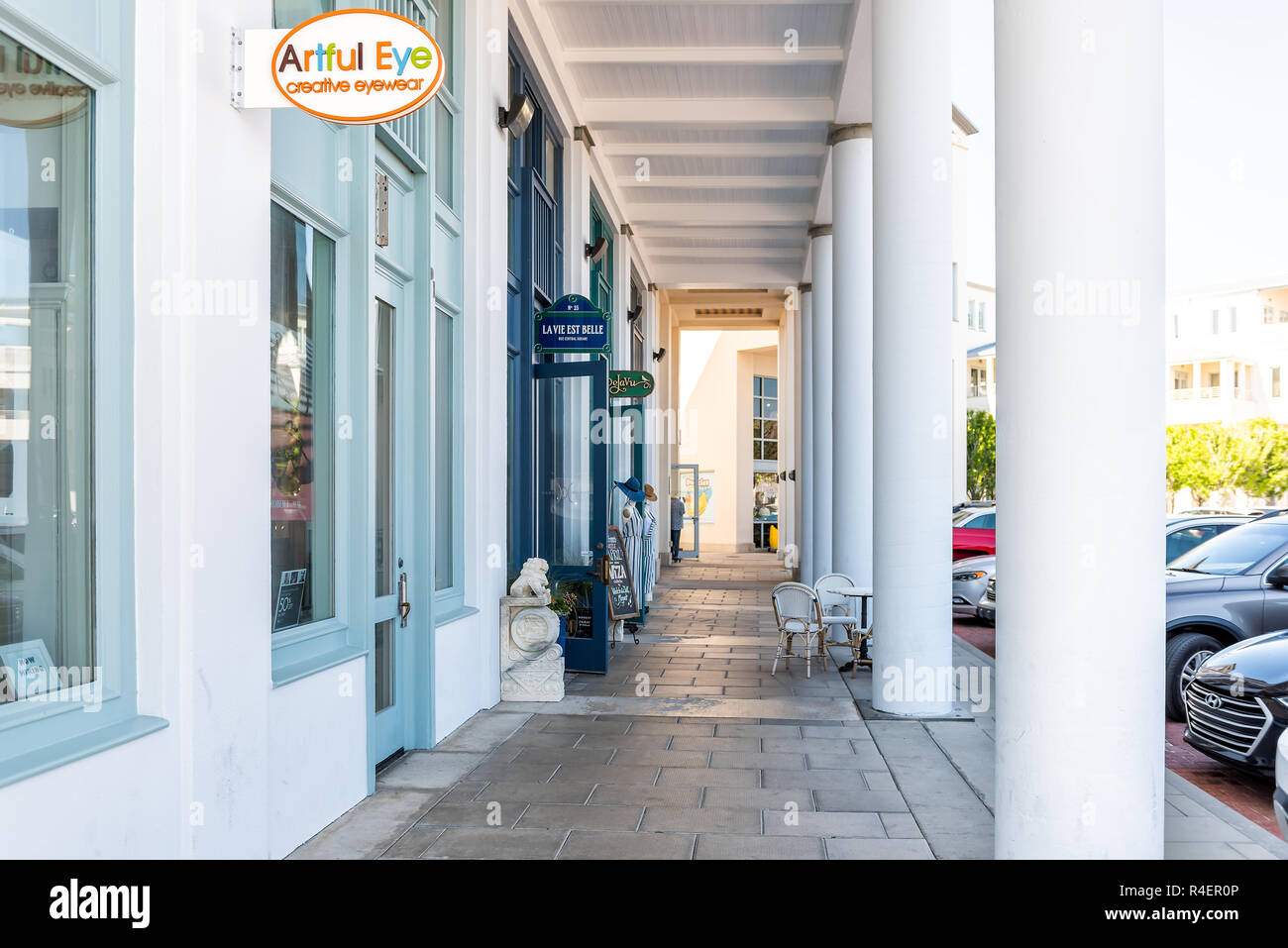 Seaside, USA - April 25, 2018: Nobody on outdoor shopping mall passage, street in city town village by beach during sunny day in Florida panhandle gul Stock Photo