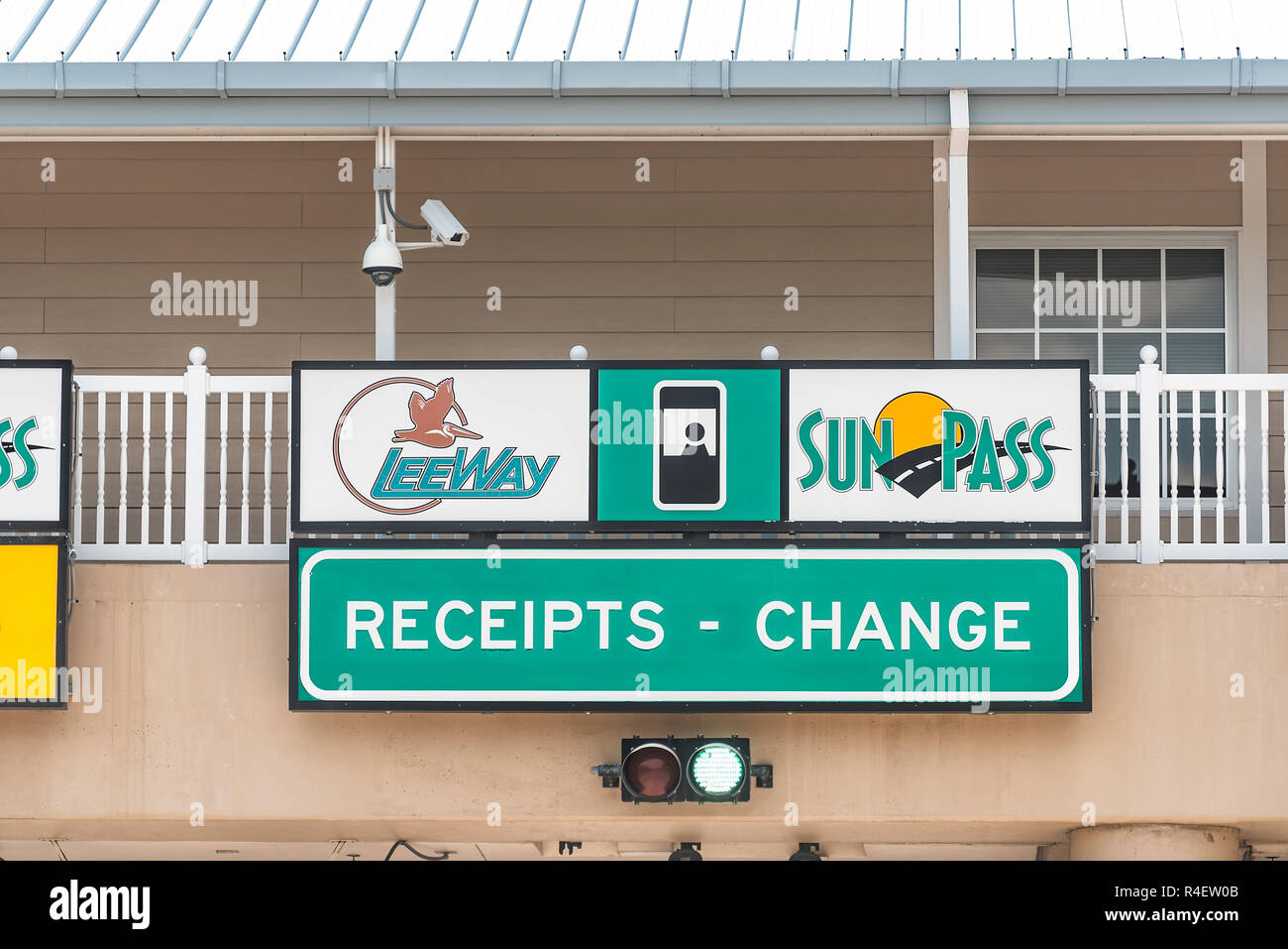 Fort Myers, USA - April 29, 2018: Road street highway green signs for Leeway in Florida with sunpass toll, receipts, change on Sanibel Island bridge c Stock Photo