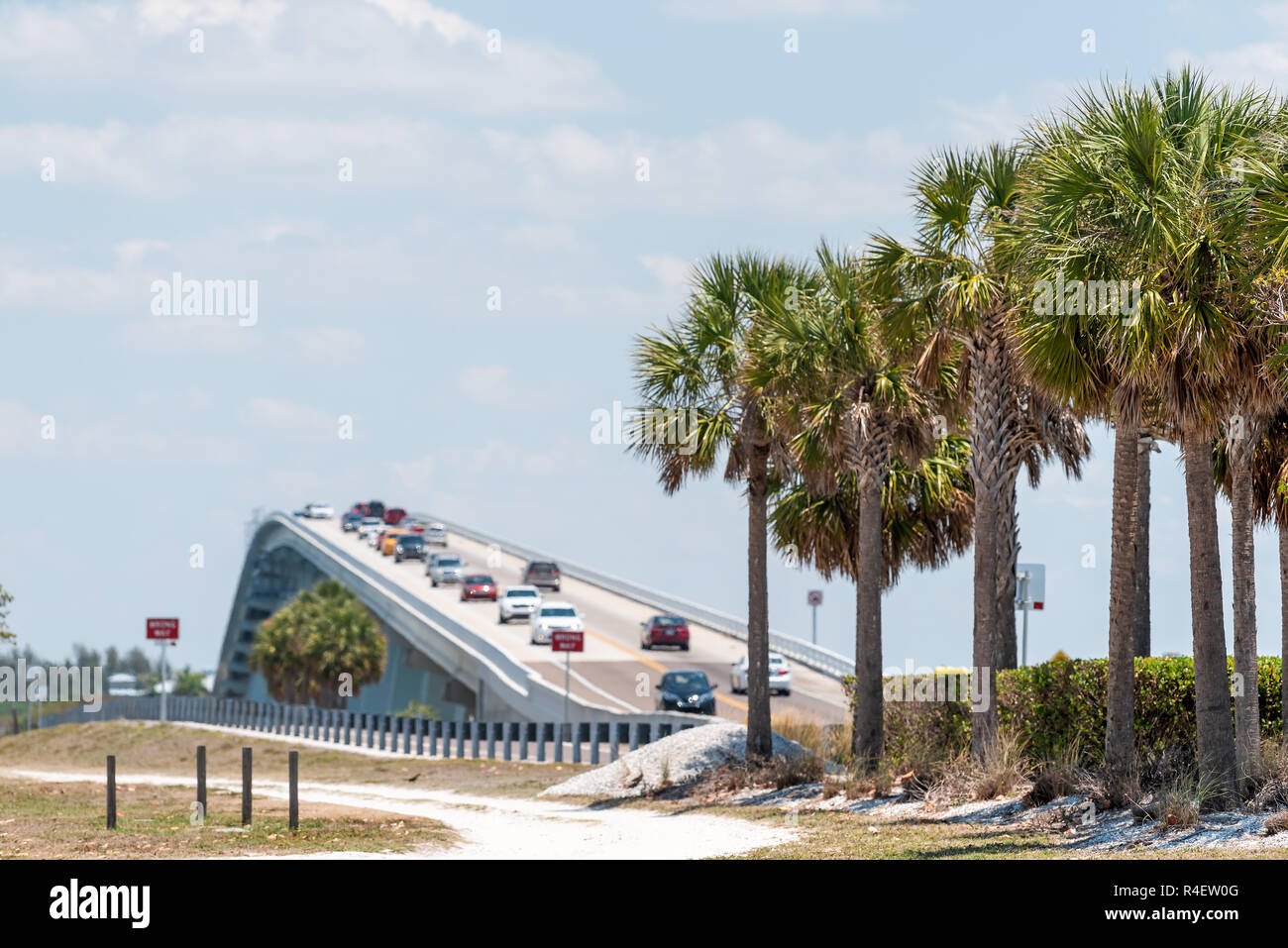 Sanibel Island, USA bay on beach during sunny day with toll bridge