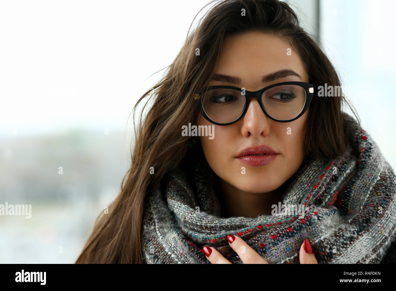 Young beautiful woman in a scarf portrait is Stock Photo