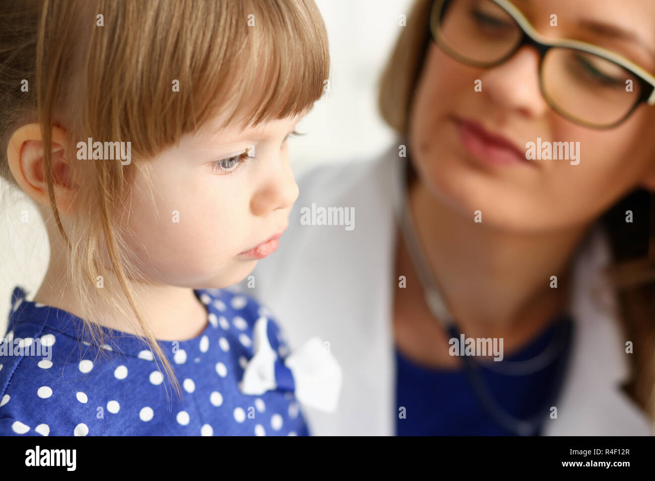 Little child with mother at pediatrician reception Stock Photo Alamy