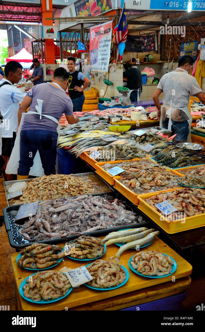 Malaysian fresh seafood fish seller at stall Satok Weekend Market