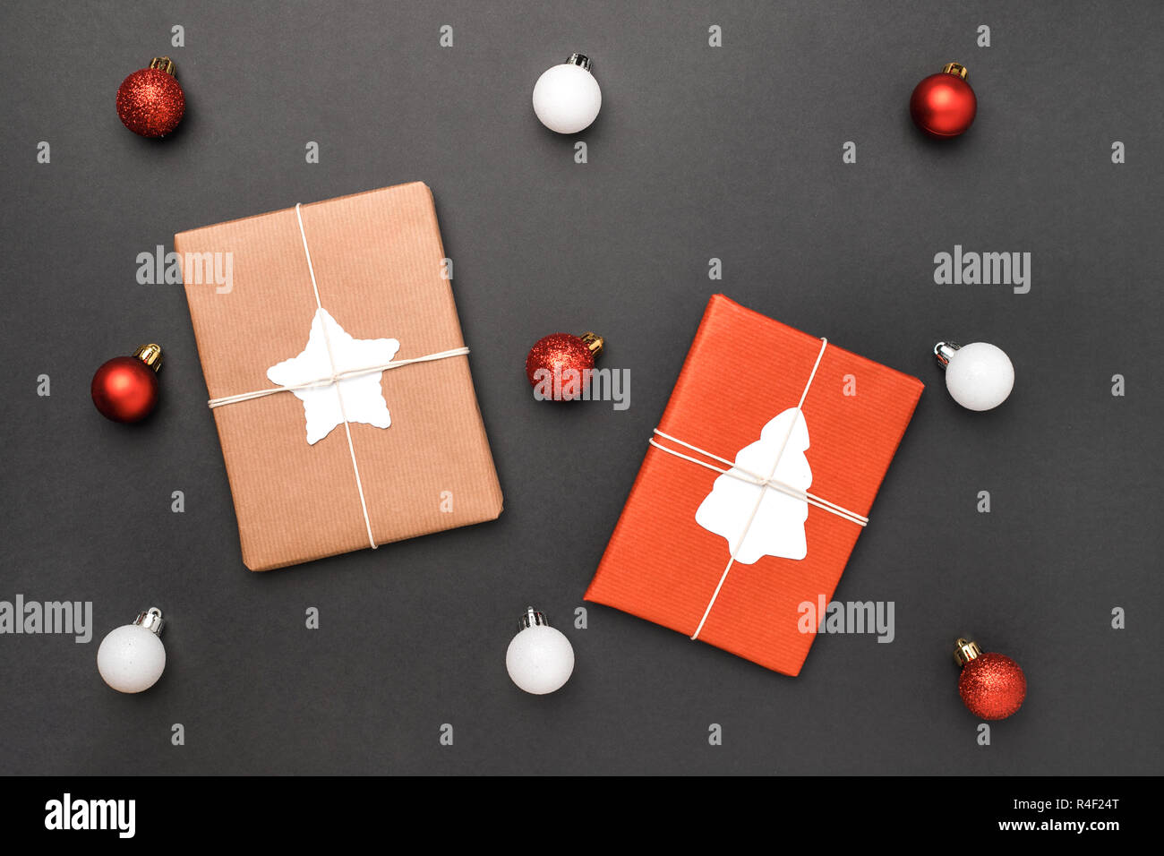 Christmas gifts and balls on black background Stock Photo - Alamy