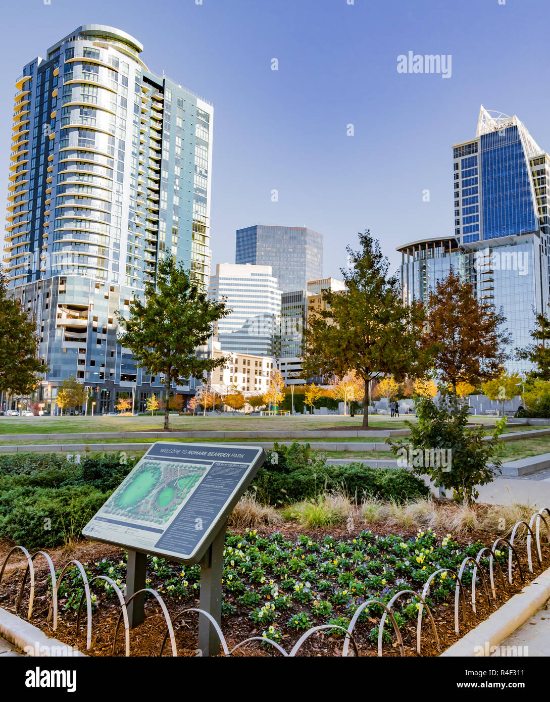 CHARLOTTE, NC, USA-11/21/18: Romare Bearden Park with skyscrapers in the background. Stock Photo