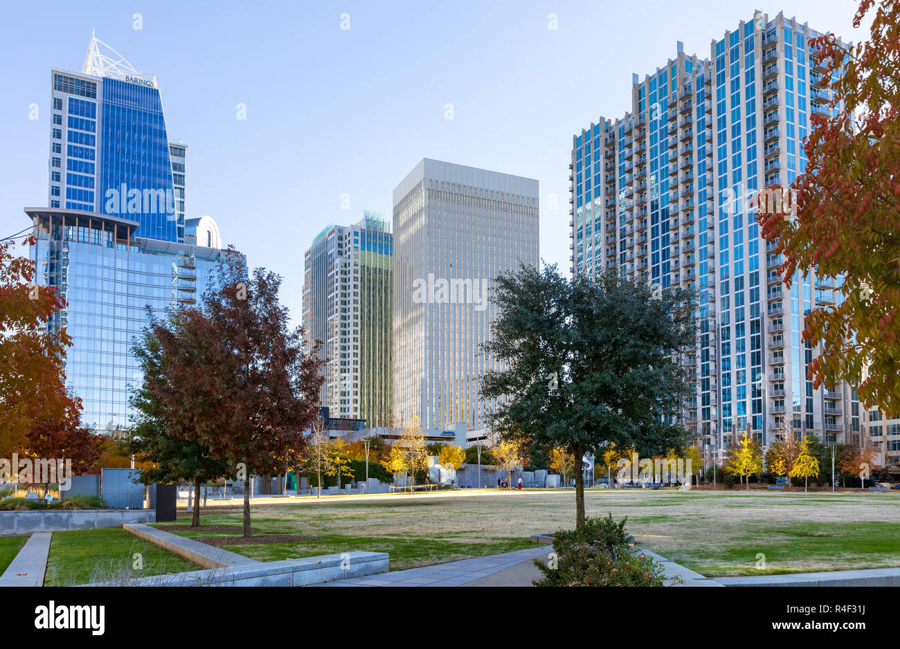 CHARLOTTE, NC, USA-11/21/18: Romare Bearden Park, with skyscrapers in the background. Stock Photo