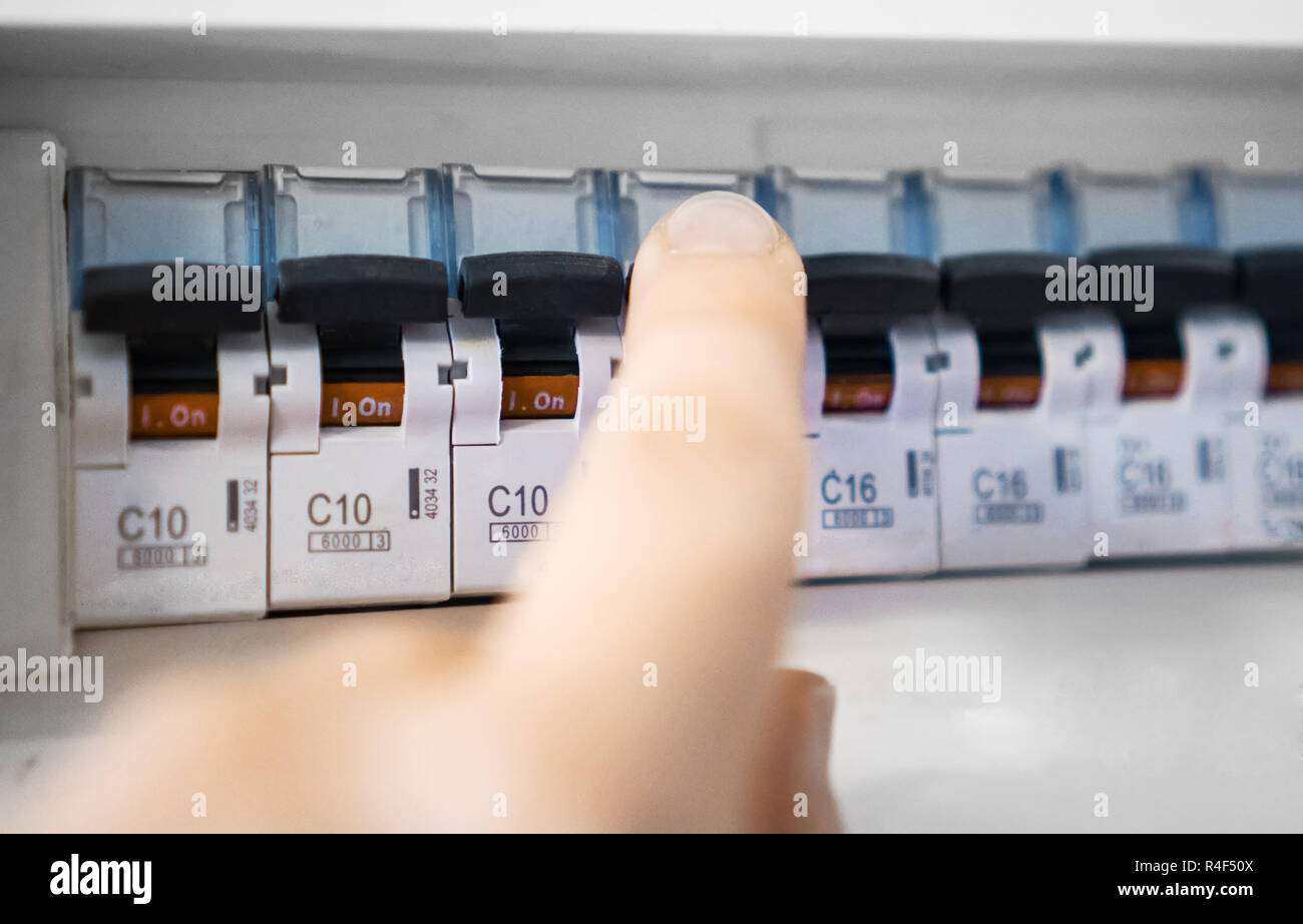 Male hand switching off fuse board Stock Photo Alamy