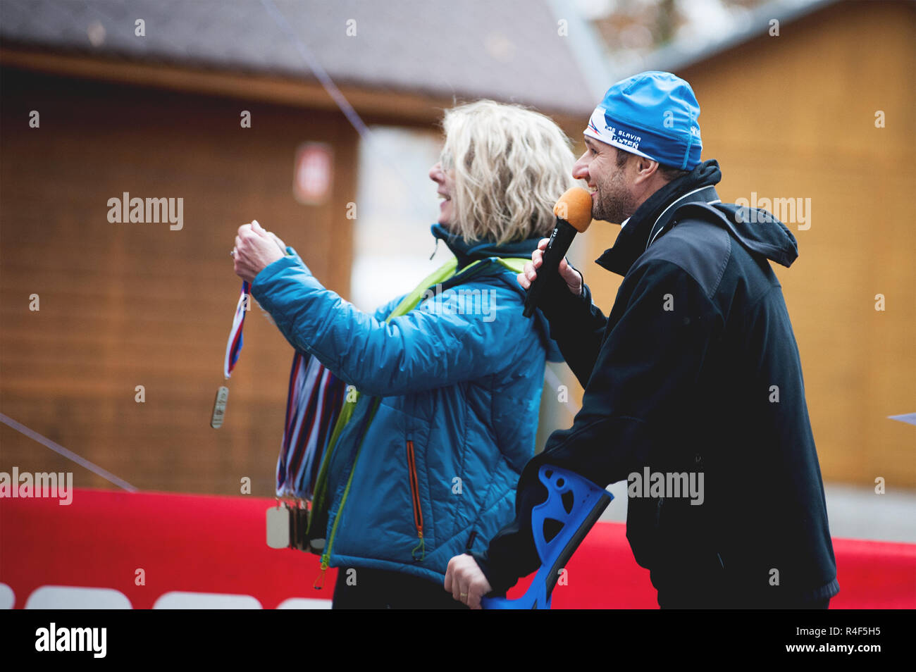 Czech Republic, Pilsen, November 2018: Hannah Pilsen Trail Krkavec. The Moderator and Woman with Medals for the Participants Waiting at the Finish of  Stock Photo