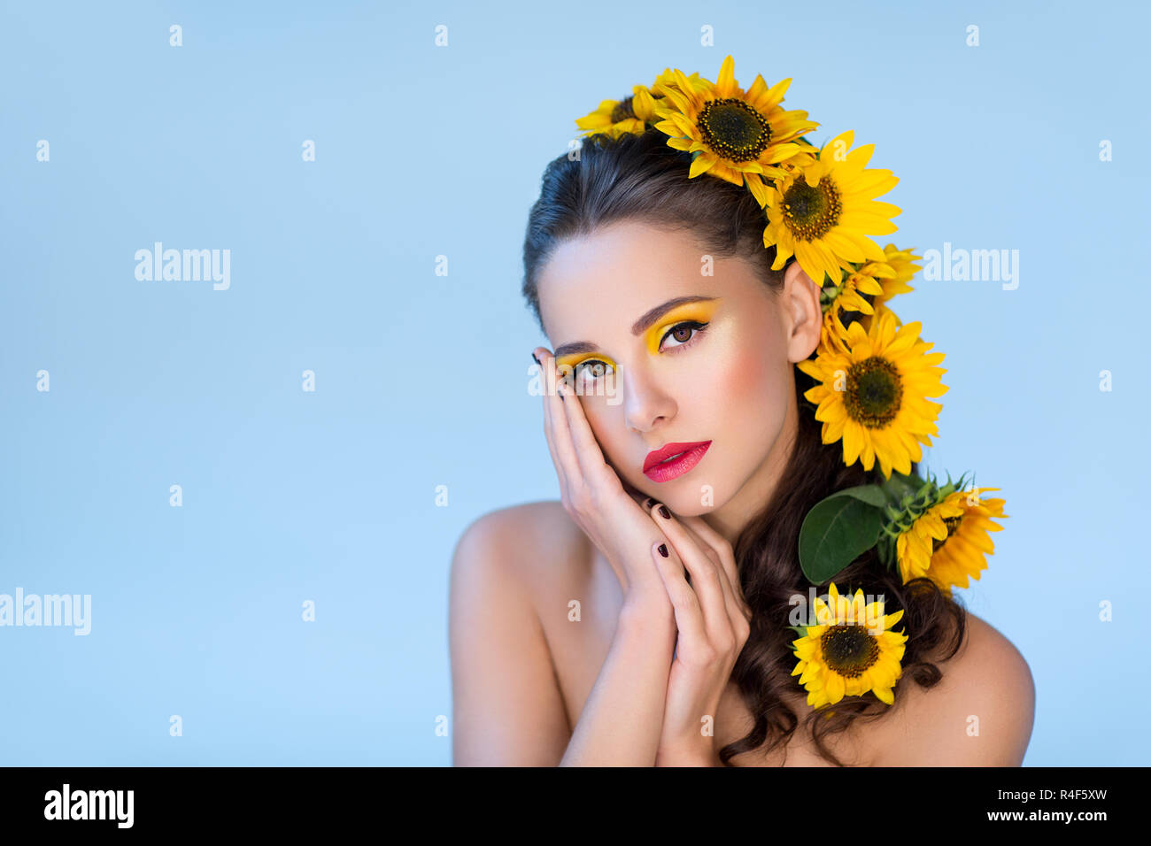 Beautiful girl with flowers in hair Stock Photo - Alamy