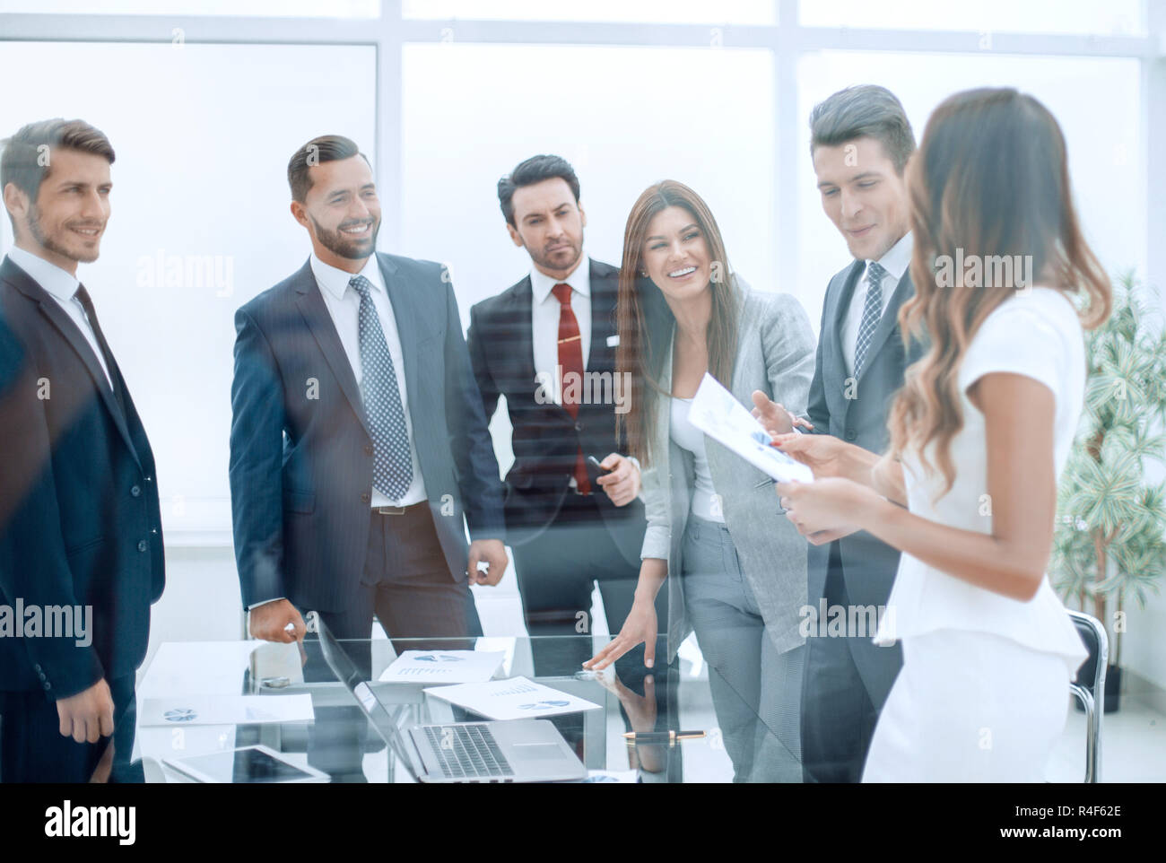 happy business team standing in new office Stock Photo - Alamy