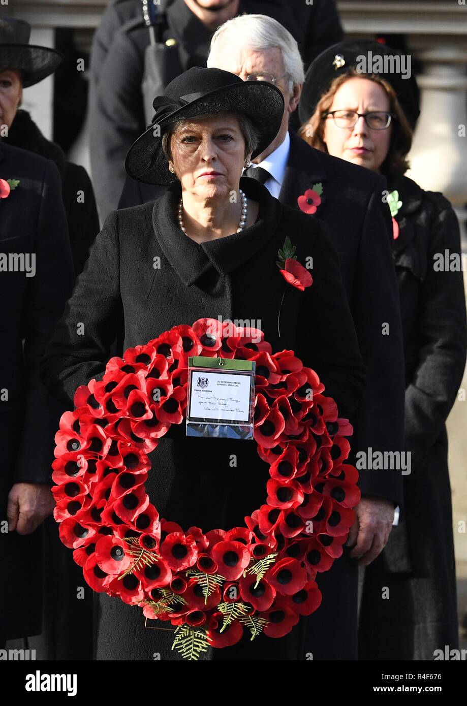 11/11/2018. London, United Kingdom. Remembrance Sunday and the Centenary of the Armistice. Theresa May and Jeremy Corbyn join the Queen Elizabeth II accompanied by members of the  Royal family including Prince Charles, Prince of Wales and Camilla, The Duchess of Cornwall,  Prince William, Duke of Cambridge and Catherine, The  Duchess of Cambridge,  Prince Harry, The Duke of Sussex and Meghan, The Duchess of Sussex , attend the Remembrance Sunday service at The Cenotaph in central London on  the Centenary of the end of the First World War.  Picture by Andrew Parsons / Parsons Media Stock Photo