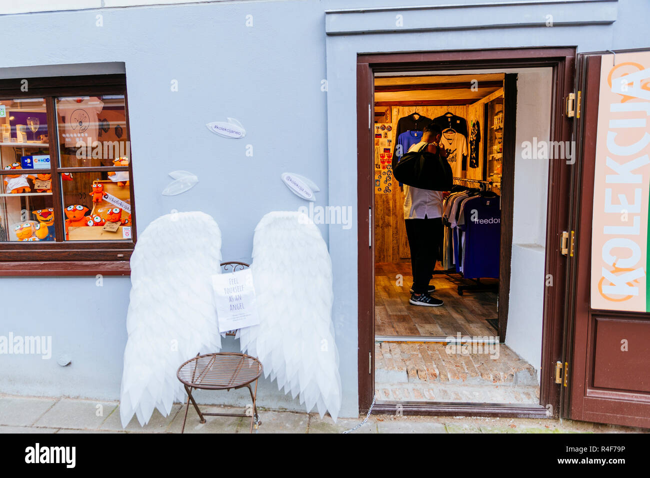 Angel wings at the entrance of a fashion store. Uzupis is a neighborhood in Vilnius, on April 1, 1997, the district declared itself an independent rep Stock Photo