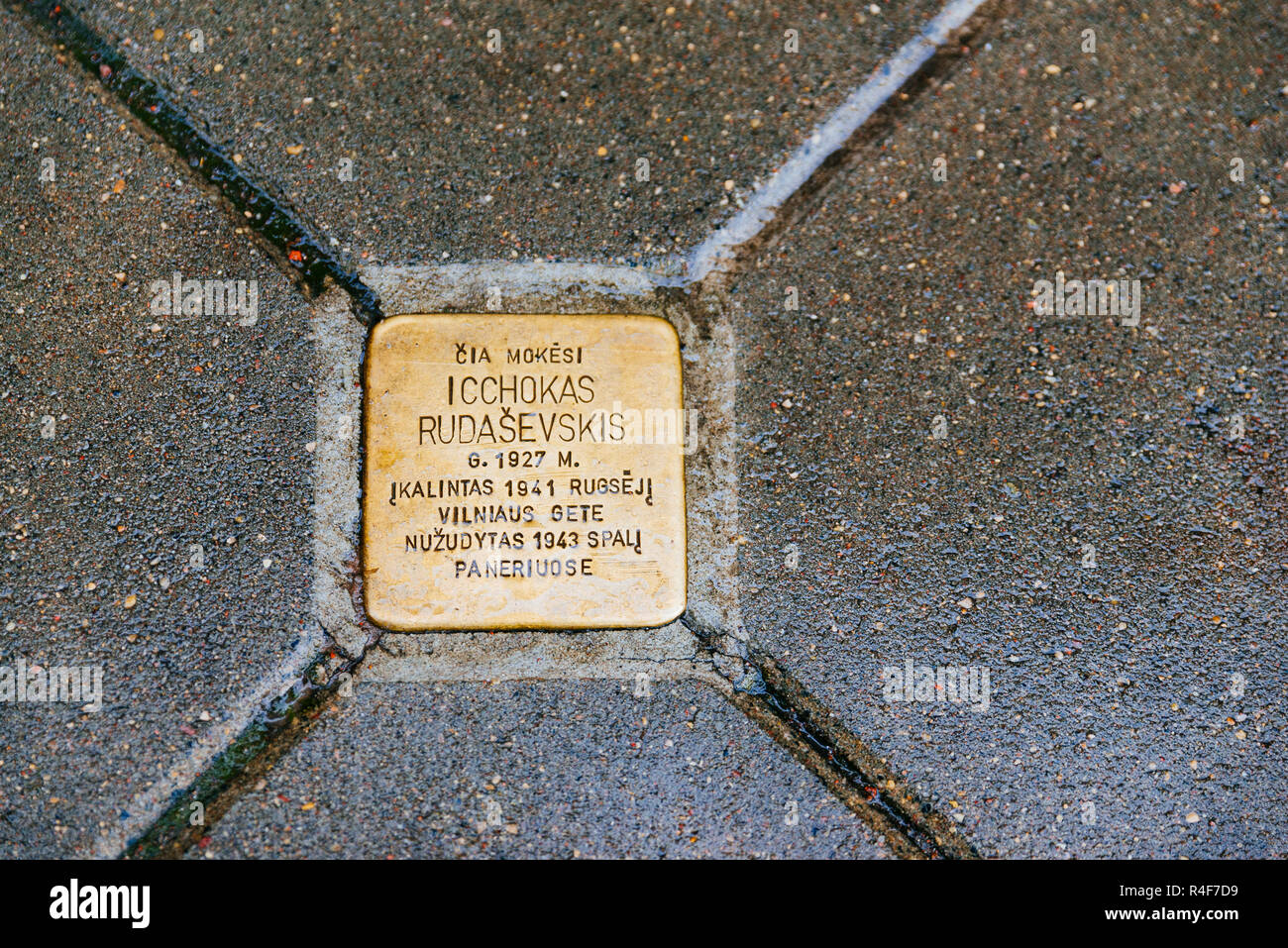 Copper-plated ‘Memorial plaques’ embedded in the pavement of the old Town of Vilnius to commemorate the memory of residents of the city who fell victi Stock Photo