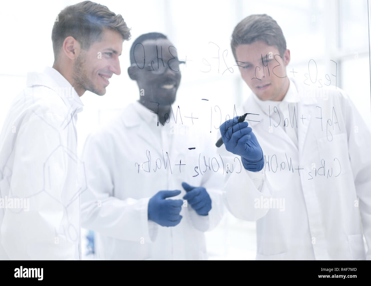 promising scientist makes notes on the Board Stock Photo