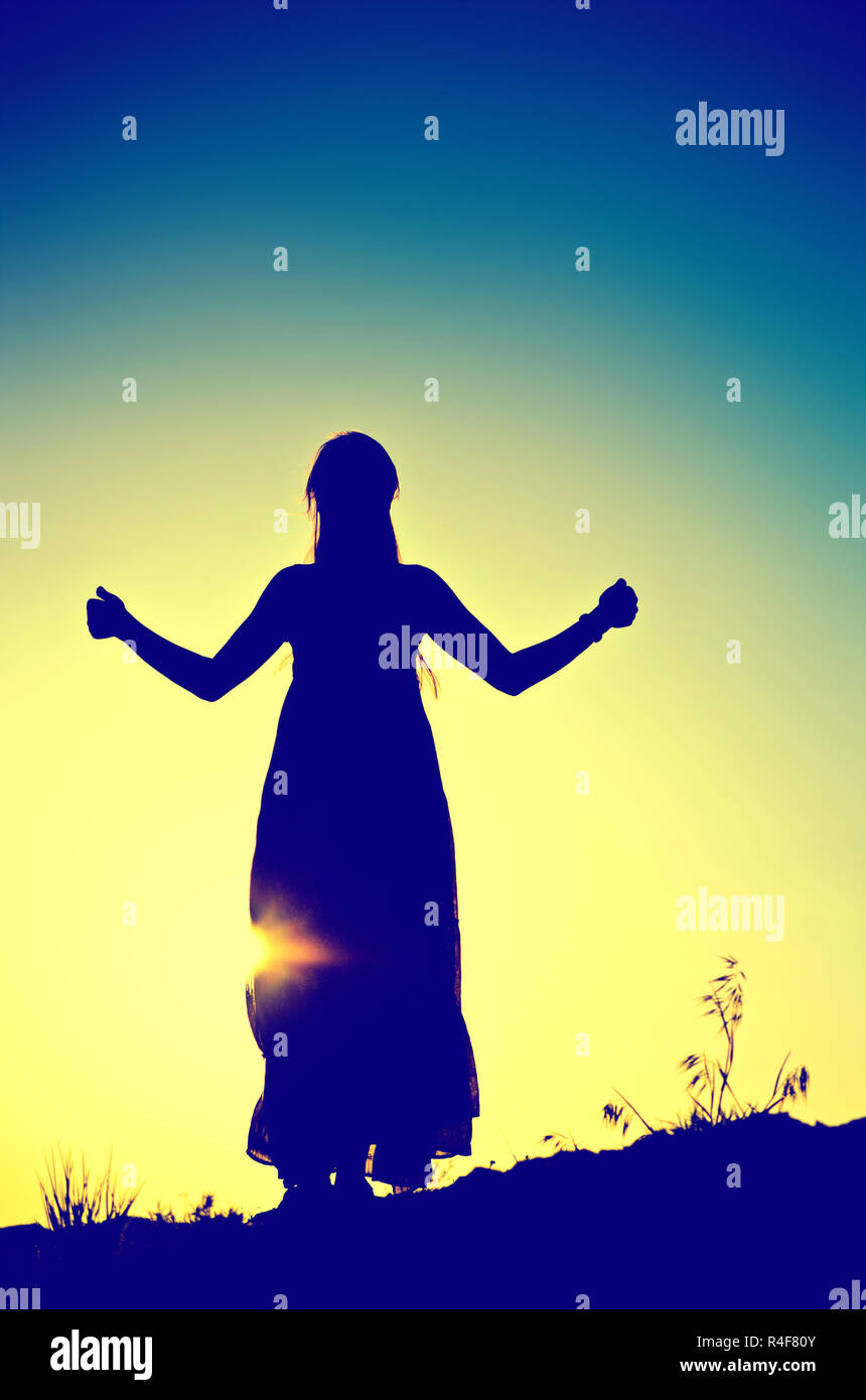 woman silhouette in front of a sunset Stock Photo - Alamy