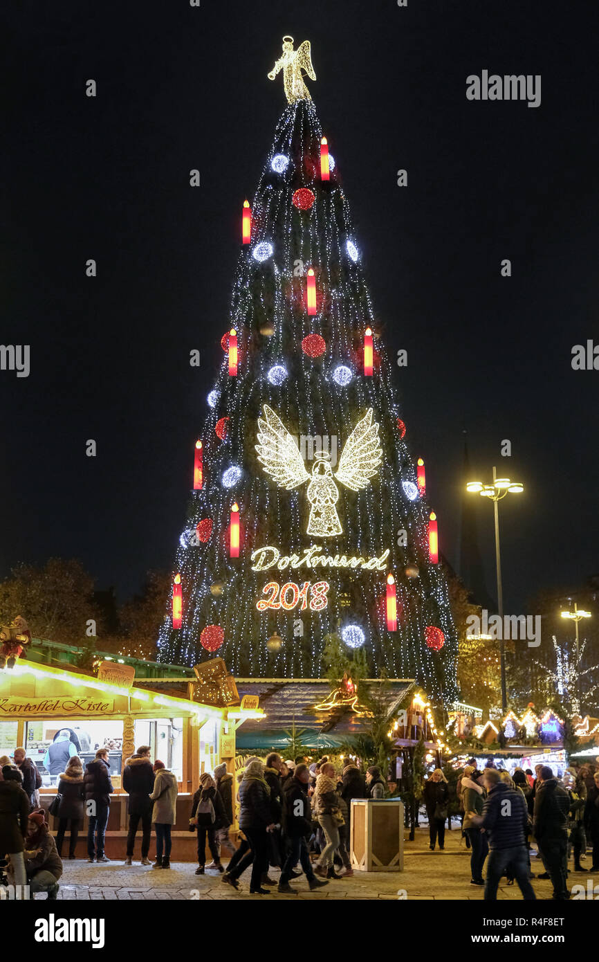 The biggest Christmas tree is on the Christmas market in Dortmund, Germany.  45 meters high, built of 1700 spruce trees, 40.000 LED lights, large red  candles and decorated with angels Stock Photo - Alamy