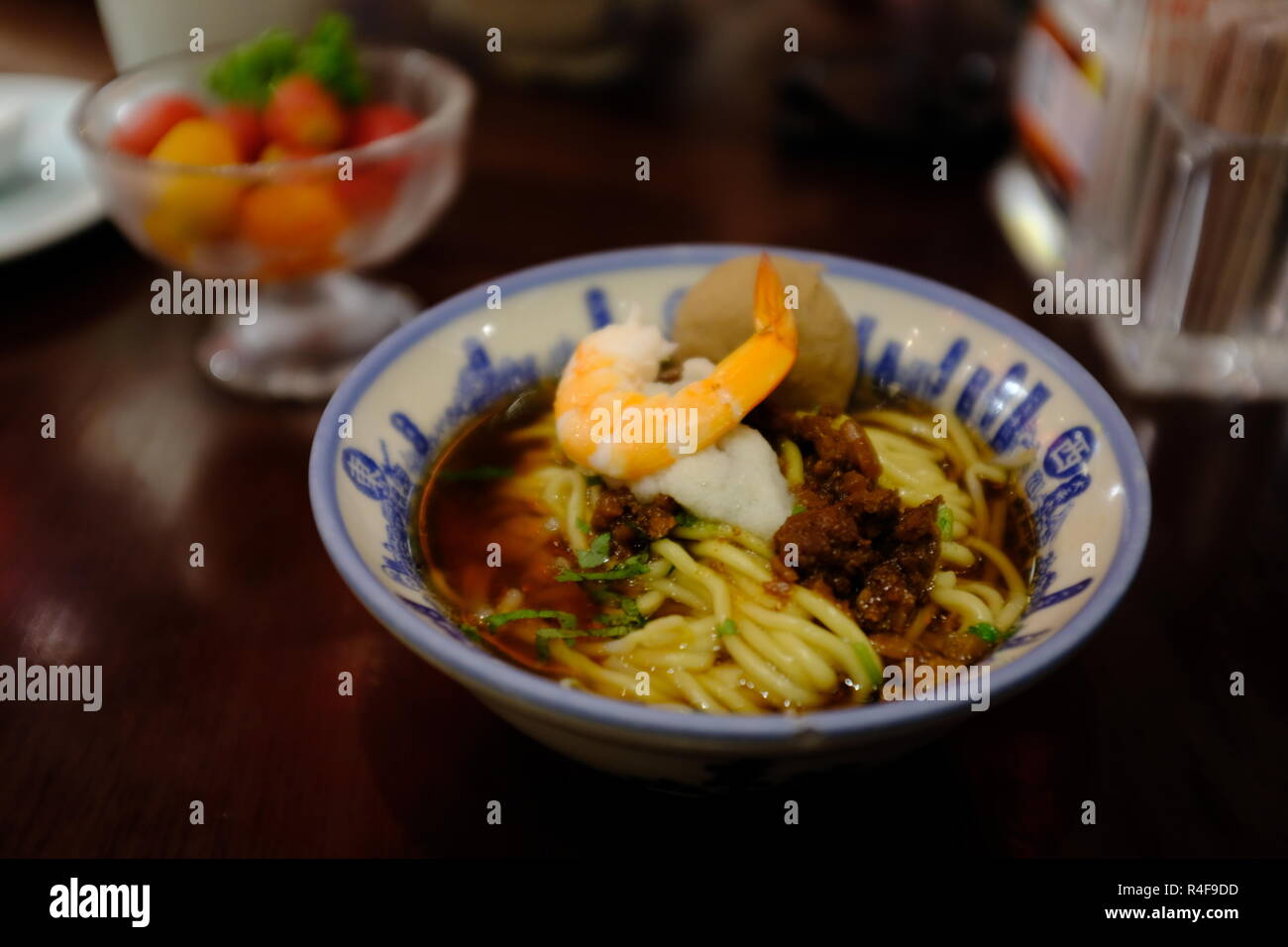 Chinese noodle with shrimp and meatball on top Stock Photo