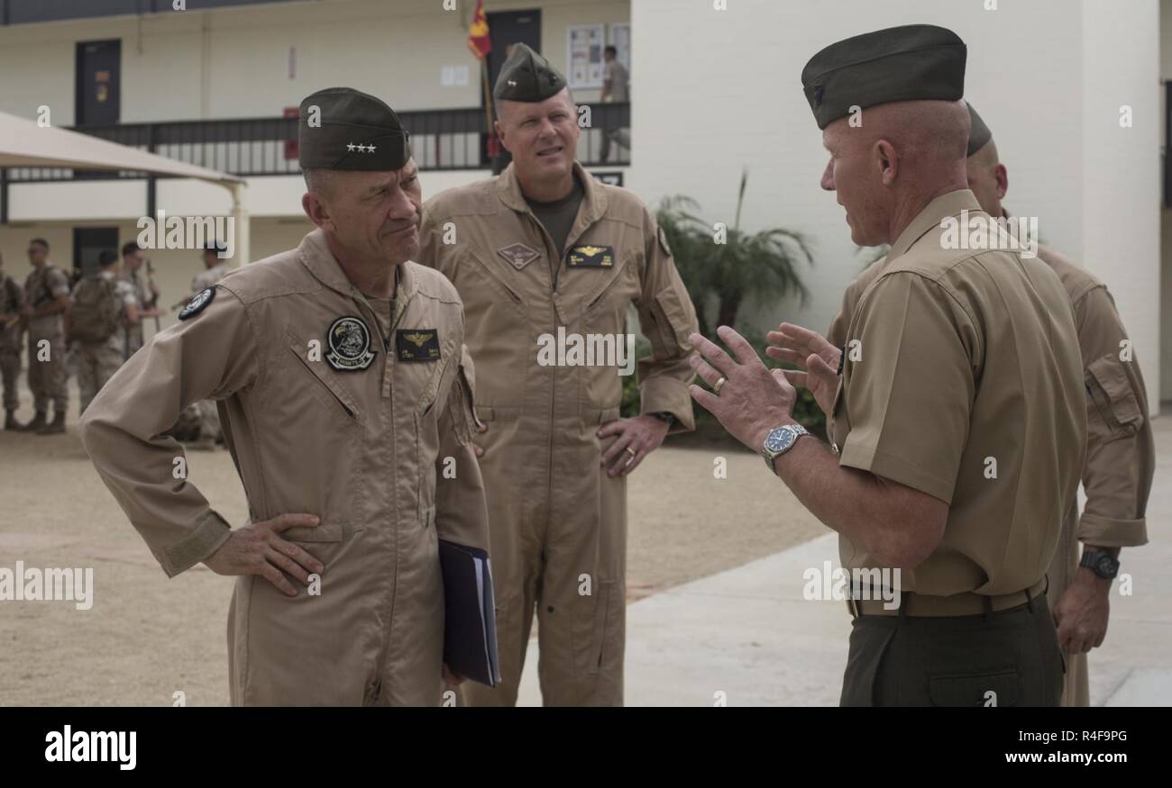 From left to right, U.S. Marine Corps Lt. Gen. Jon Davis, deputy commandant for aviation, Maj. Gen. Mark Wise, 3rd Marine Aircraft Wing (MAW) commanding general, are greeted by Col. Richard Fuerst, commanding officer of Marine Corps Air Station (MCAS) Iwakuni, Japan, at MCAS Yuma, Ariz. Oct. 24, 2016. This event gave Yoshihiko Fukuda, mayor of Iwakuni City, Japan, an idea of what to expect of the aircraft following the scheduled basing of Marine Fighter Attack Squadron (VMFA) 121 at MCAS Iwakuni. After its transition, VMFA-121 will be the first F-35B squadron stationed in Japan. Stock Photo