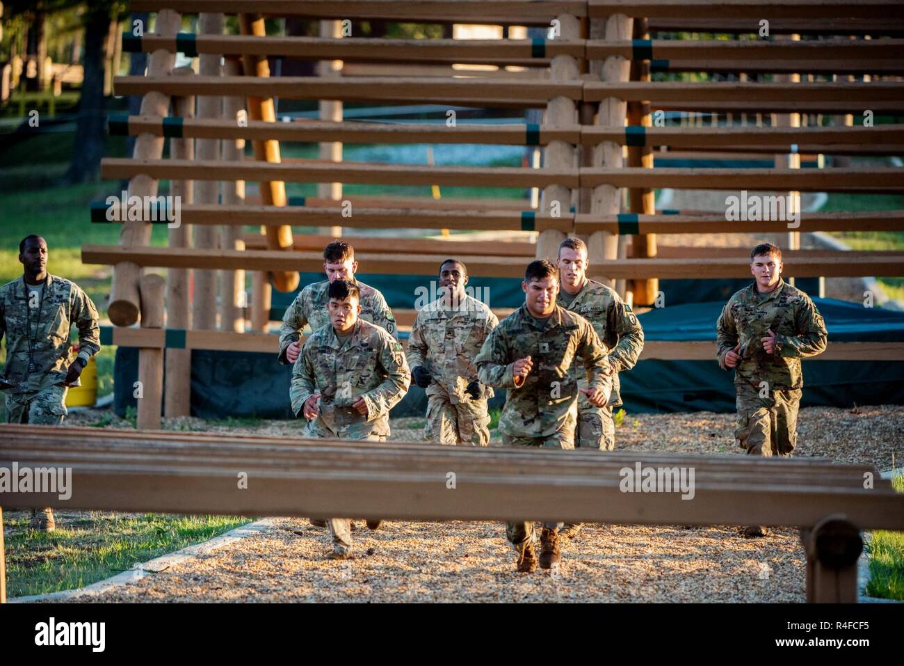 (FORT BENNING, Ga) – The Scout Squad representing 2-14 Cav, 25th Infantry Division approach an obstacle during the 2017 Gainey Cup Best Scout Squad Competition prior to conducting the Squad Stress Shoot on May 2, 2017, at Simpson Range on Main Post. The biennial Gainey Cup Competition is designed to identify the most competent and versatile Scout Squad in the US Armed Forces and partnering Allies through an extremely challenging contest centered on essential reconnaissance and security tasks and skills. Stock Photo