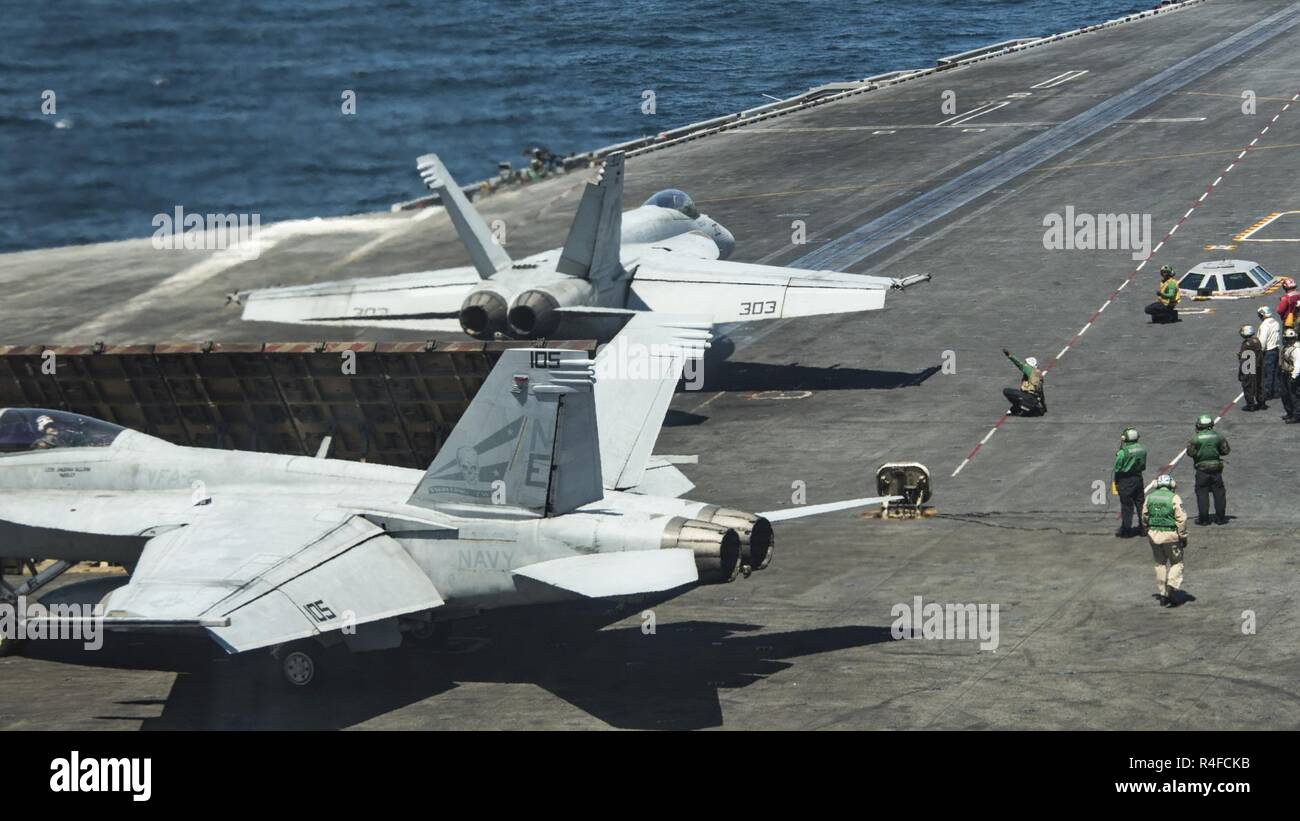 PACIFIC OCEAN (May 1, 2017) An F/A-18E Super Hornet from the “Golden Dragons” of Strike Fighter Squadron (VFA) 192 prepares to take off from the Nimitz-class aircraft carrier USS Carl Vinson (CVN 70) during flight operations in the western Pacific Ocean. The U.S. Navy has patrolled the Indo-Asia-Pacific routinely for more than 70 years promoting regional peace and security. Stock Photo