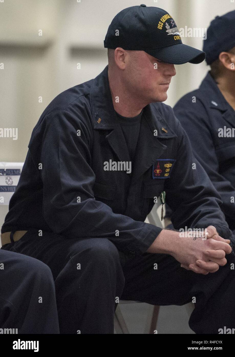 ARABIAN GULF (May 1, 2017) Ensign Christopher Helms listens during 