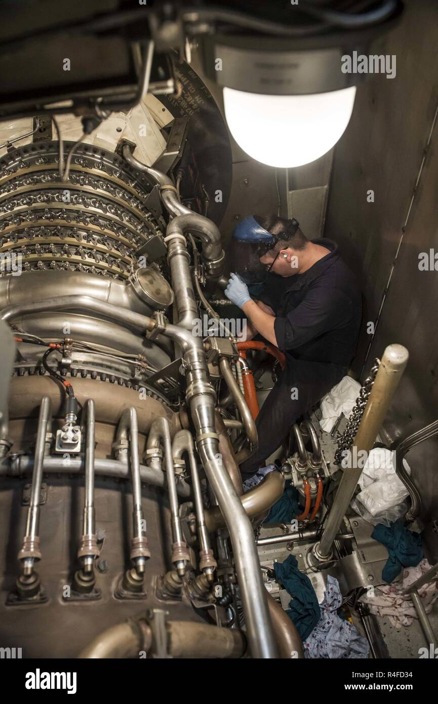 MEDITERRANEAN SEA (May 2, 2017) Gas Turbine Systems Technician (Mechanical) 3rd Class Lonnie Adkins, from Greenfield, Ohio, performs maintenance on a gas turbine motor aboard the Arleigh Burke-class guided-missile destroyer USS Ross (DDG 71) May 2, 2017. Ross, forward-deployed to Rota, Spain, is conducting naval operations in the U.S. 6th Fleet area of operations in support of U.S. national security interests in Europe and Africa. Stock Photo