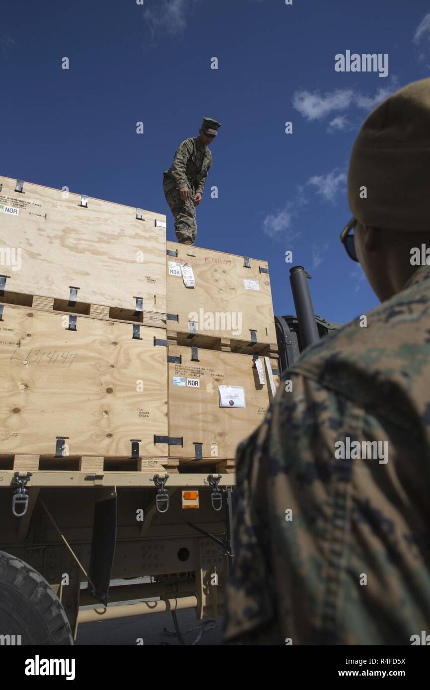 U.S. Marine Corps Cpl. Mohamed Hussain and Lance Cpl. Rodney Raber, motor vehicle operators with 2nd Transport Support Battalion, place boxes on a truck during Strategic Mobility Exercise 17 (STRATMOBEX) near Stjordal, Norway, May 2, 2017.  STRATMOBEX is a logistics-based exercise involving the preparation and movement of equipment from cave sites of the Marine Corps Prepositioning Program in Norway. Stock Photo
