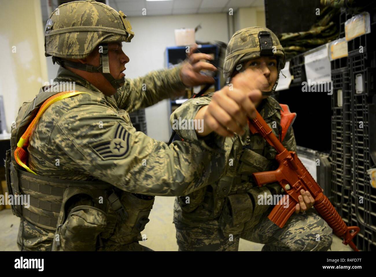 U.S. Air Force Staff Sgt. Corey Sokoloski tightens a tourniquet above a ...