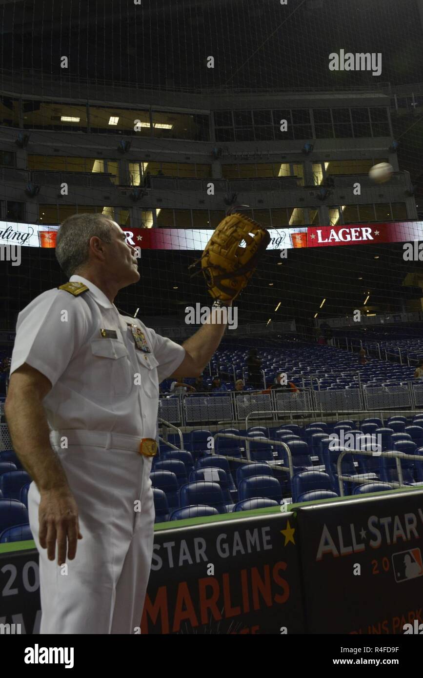 MIAMI, Fla. -- Rear Admiral Roy I. Kitchener warms up prior to the Marlins versus Rays baseball game at the Marlins Stadium May 2, 2017. Kitchener, the commander of Expeditionary Strike Group 2, threw the game opening ball as part of the 27th Annual Fleet Week Port Everglades. Stock Photo
