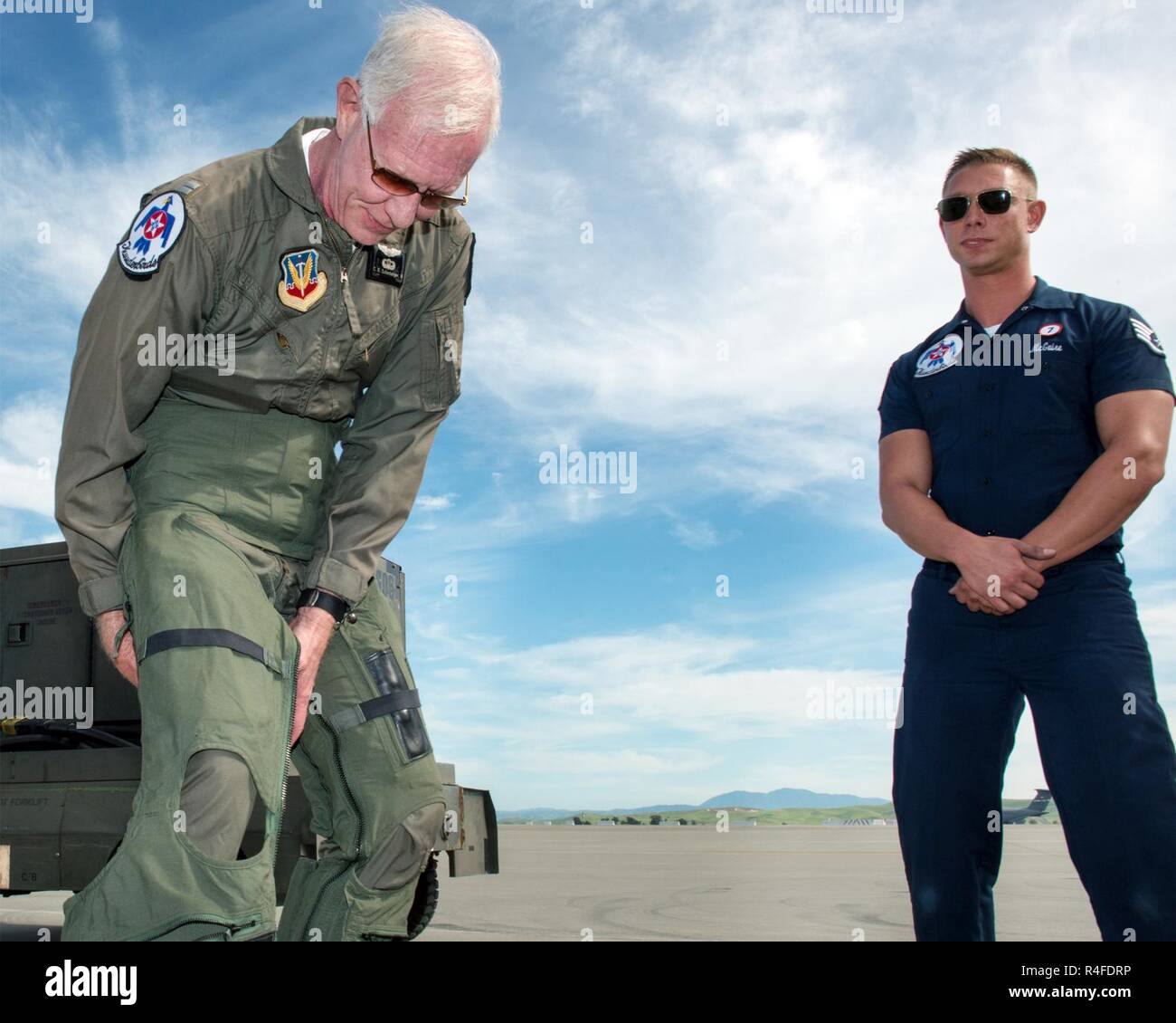 Former airline pilot Chesley “Sully” Sullenberger III puts on his G-suit before his flight with the United States Air Force Thunderbirds at Travis Air Force Base, Calif., May 4, 2017. Sullenberger is a 1973 Air Force Academy graduate and is best known for successfully landing a crippled airliner in the Hudson River saving the lives of a 155 passengers. Stock Photo