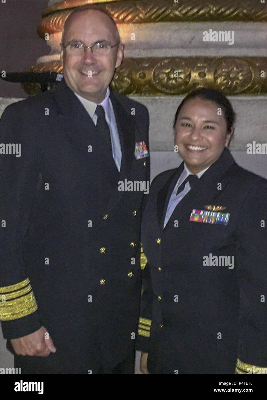 WASHINGTON (May 4, 2017) -- Vice Adm. Forrest Faison, Navy Surgeon General, left, poses for a photo with Lt. Cmdr. Tatana Olson, Heroes of Military Medicine (HMM) Award 2017 recipient during a reception at the Andrew W. Mellon Auditorium in Washington, D.C. HMM awards honor outstanding contributions by individuals who have distinguished themselves through excellence and selfless dedication to advancing military medicine. Stock Photo
