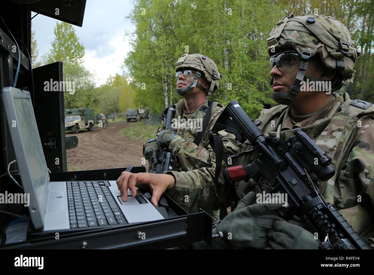 U.S. Army Sgt. Dulan Haher, left, and Sgt. Michael Ventura of Delta Company, Regimental Engineer Squadron, 2d Cavalry Regiment align a radar system while establishing a tactical operations center during Saber Junction 17 at the Hohenfels Training Area, Germany, May 4, 2017. Saber Junction 17 is the U.S. Army Europe’s 2d Cavalry Regiment’s combat training center certification exercise, taking place at the Joint Multinational Readiness Center in Hohenfels, Germany, Apr. 25-May 19, 2017. The exercise is designed to assess the readiness of the regiment to conduct unified land operations, with a pa Stock Photo